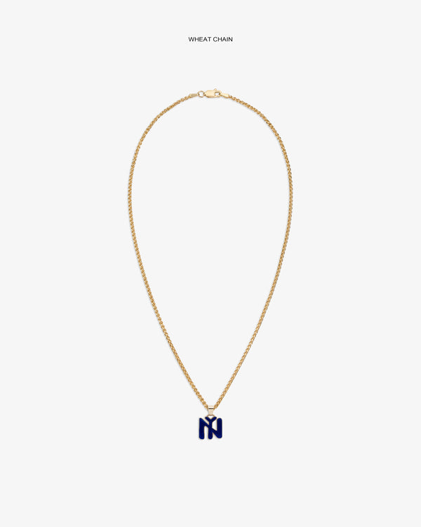 14Kt Gold Pendant: Wheat chain with a blue N-shaped charm on a plain white background.