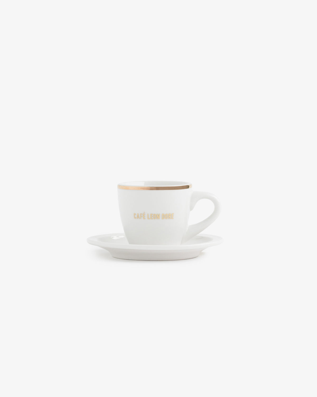 Café Leon Dore Espresso Cup with gold rim and matching saucer on a plain white background.