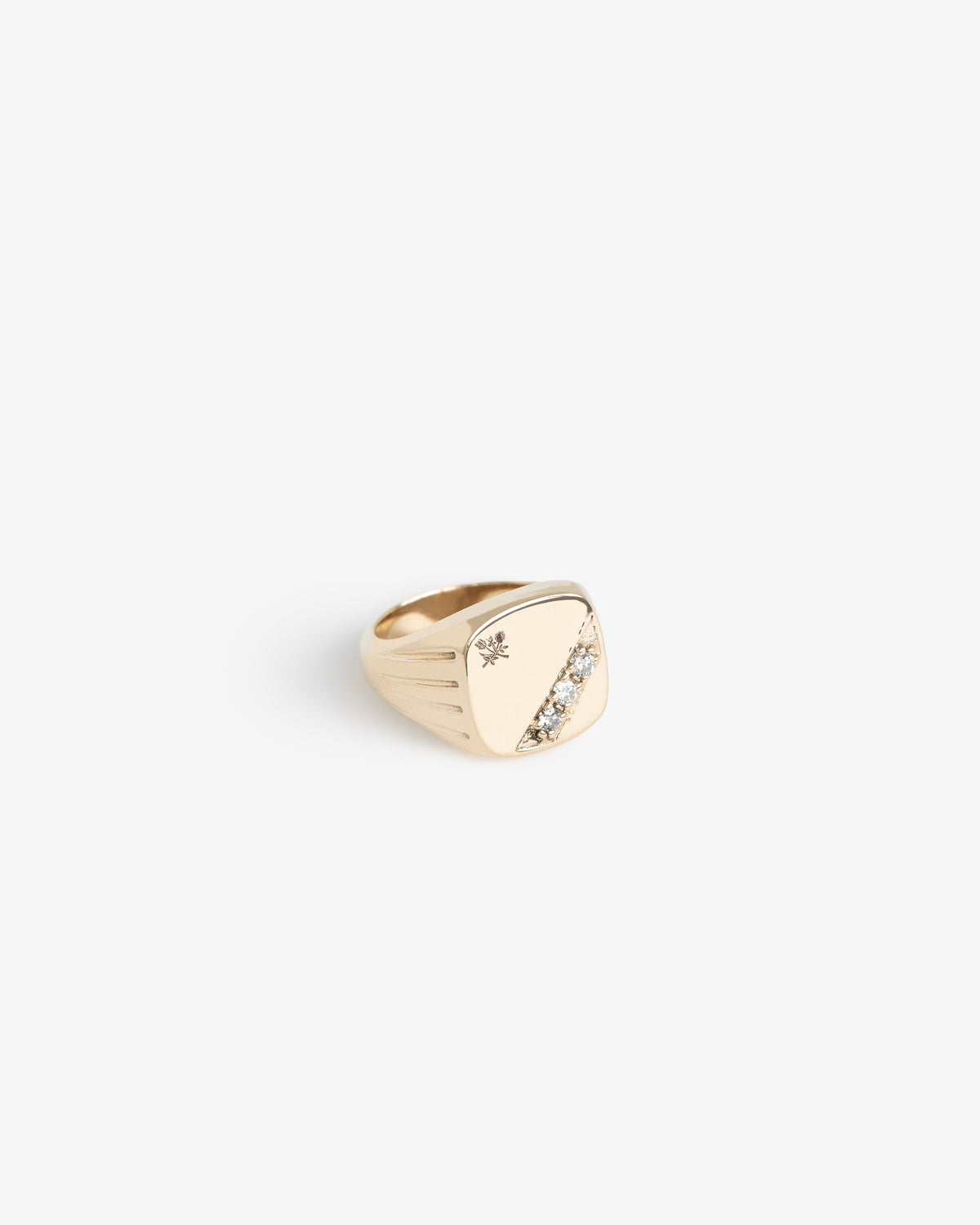 14Kt Gold Diamond Signet Ring featuring a diagonal row of diamonds and a small engraved star on top.