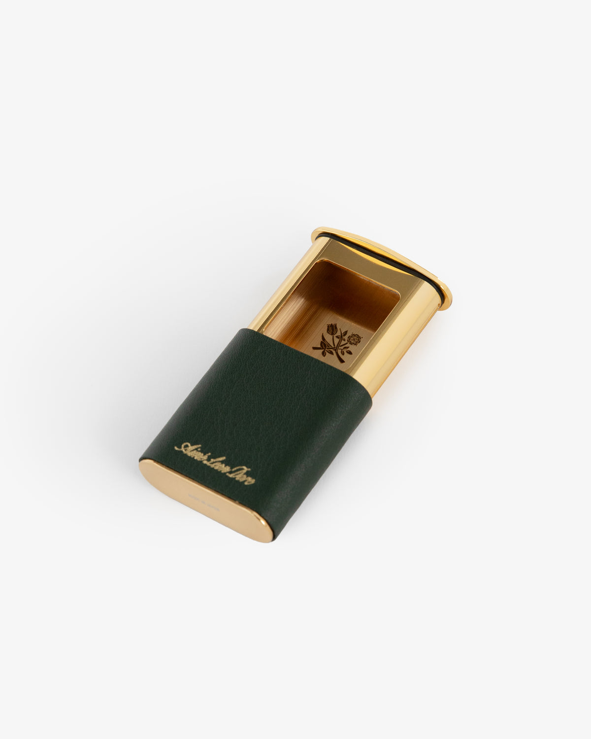 A gold and dark green Queens Crest Leather Portable Ashtray with a crest logo, shown on a white background.