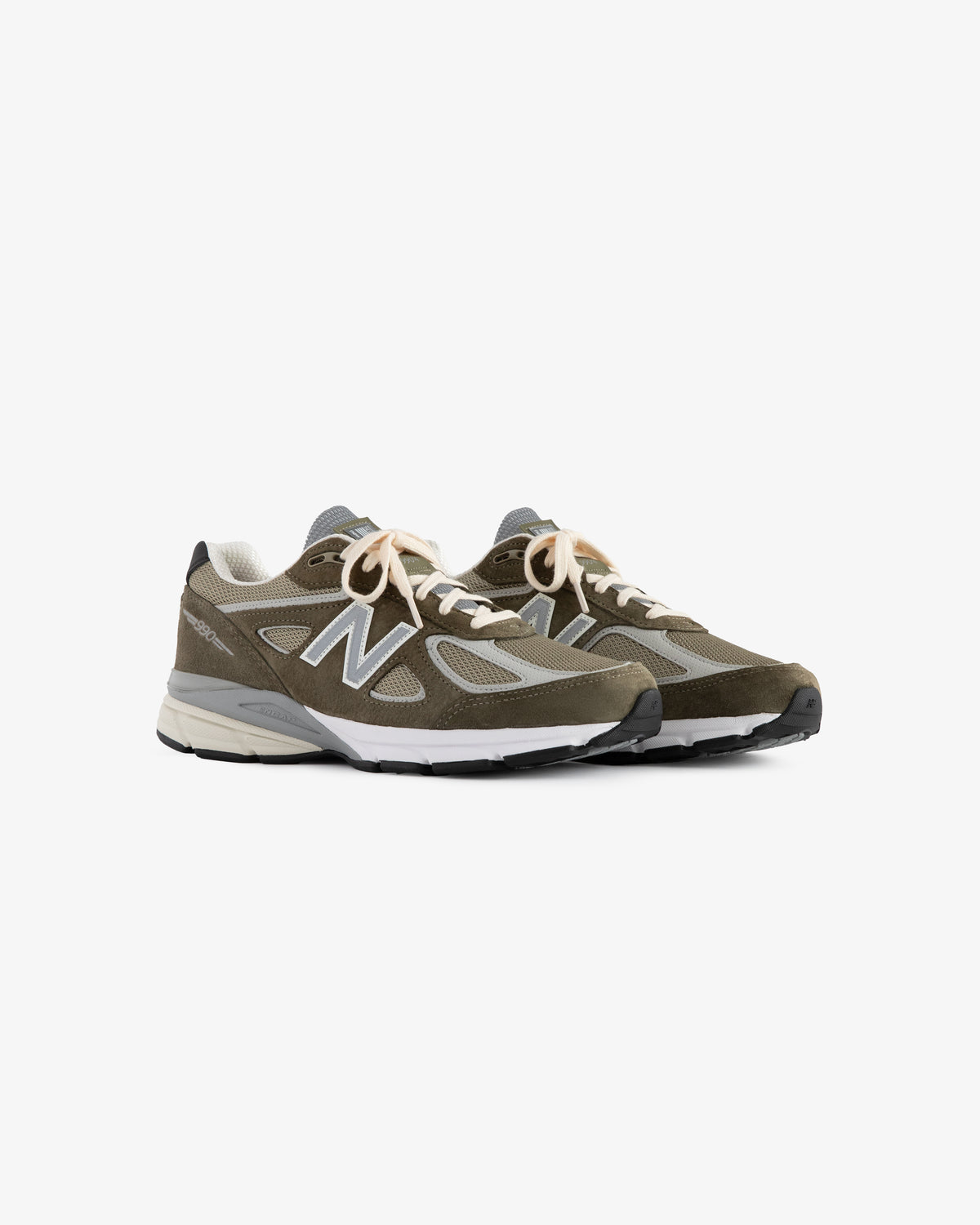 A pair of ALD / New Balance 990v4 sneakers in olive green and gray with white midsoles and beige laces.