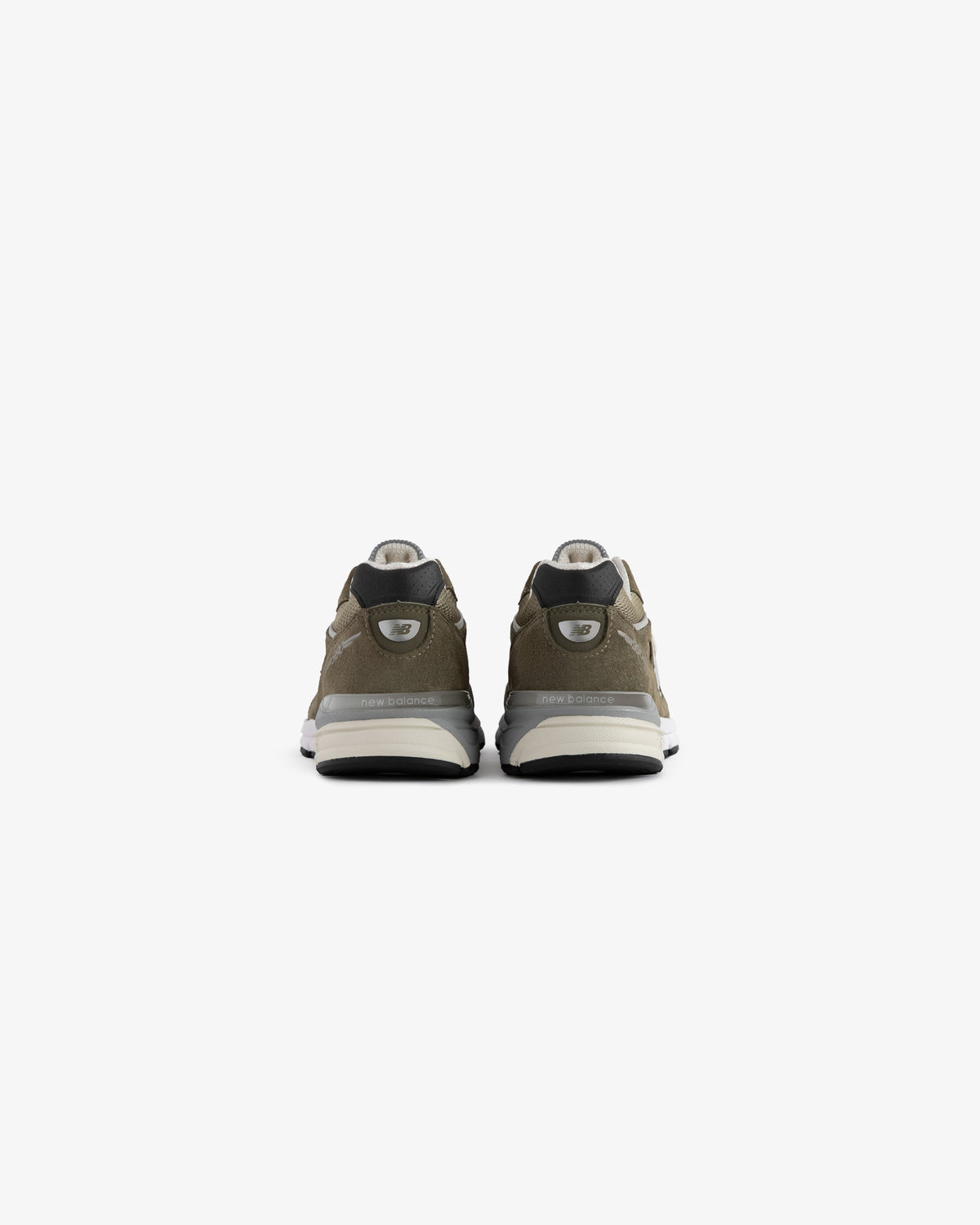 ALD / New Balance 990v4 olive green sneakers with white soles and black accents, shown from the back on white.