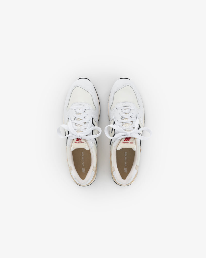 ALD / NB Made in USA 996 white athletic sneakers with laces, viewed from above on a plain white background.