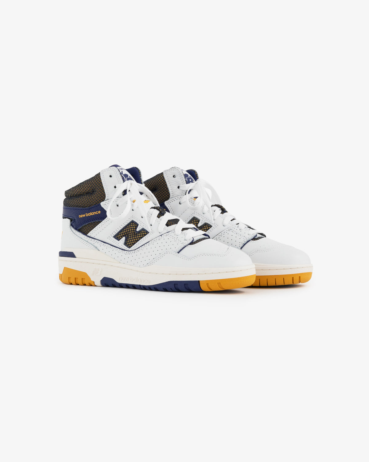 The ALD / New Balance 650R is a high-top sneaker in white, navy, and yellow with a perforated toe and mesh accents.