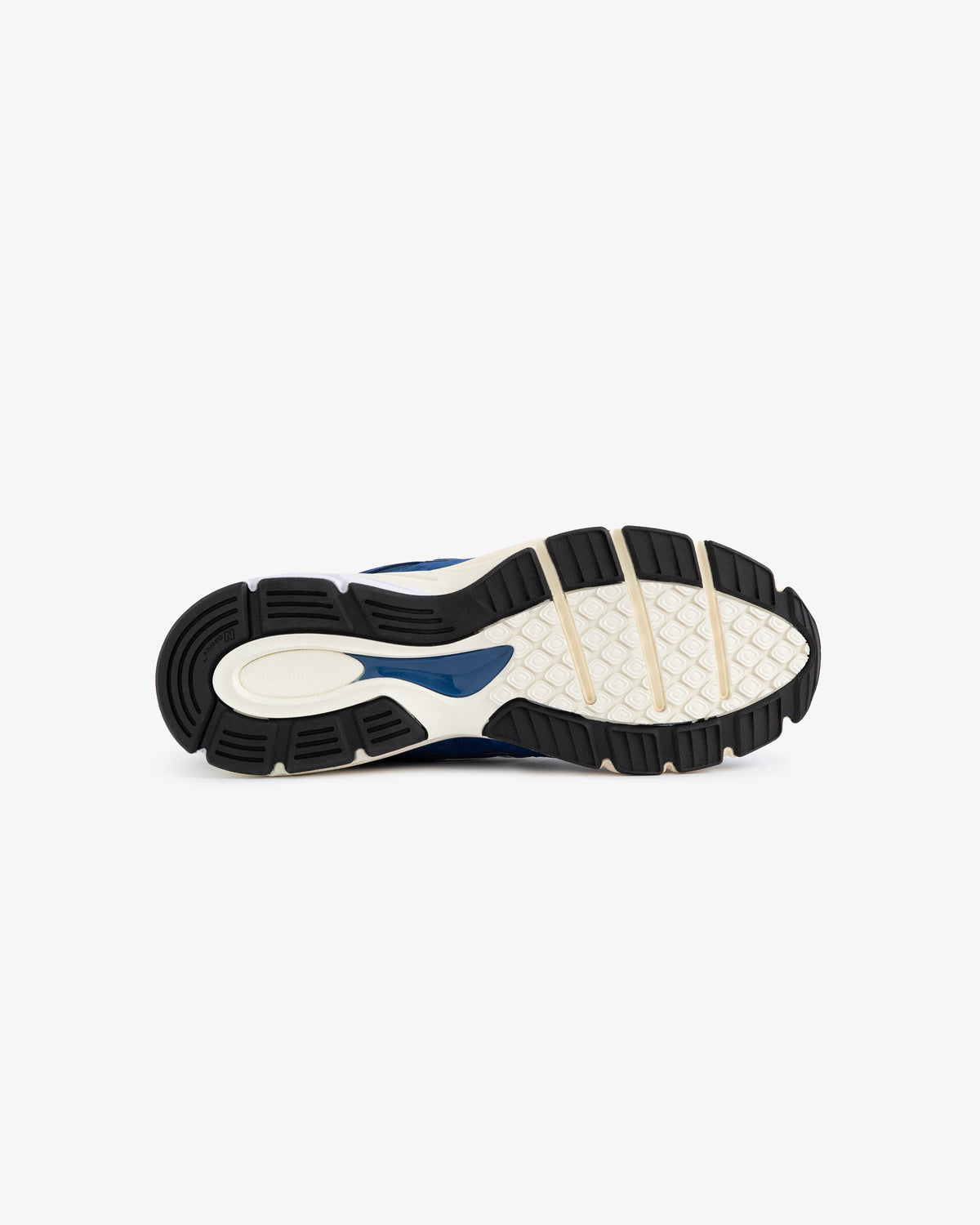 The ALD / NB Made in USA 990v4 features a textured rubber sole with black, beige, and navy blue on white.