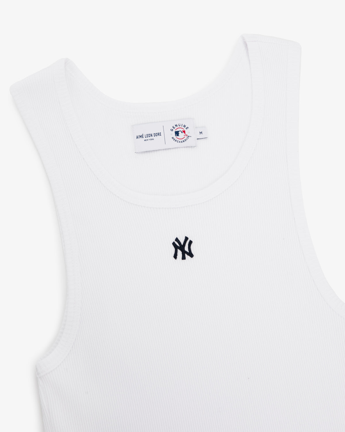 Yankees Tank Top: White ribbed tank with black New York Yankees logo on chest and visible collar tag.