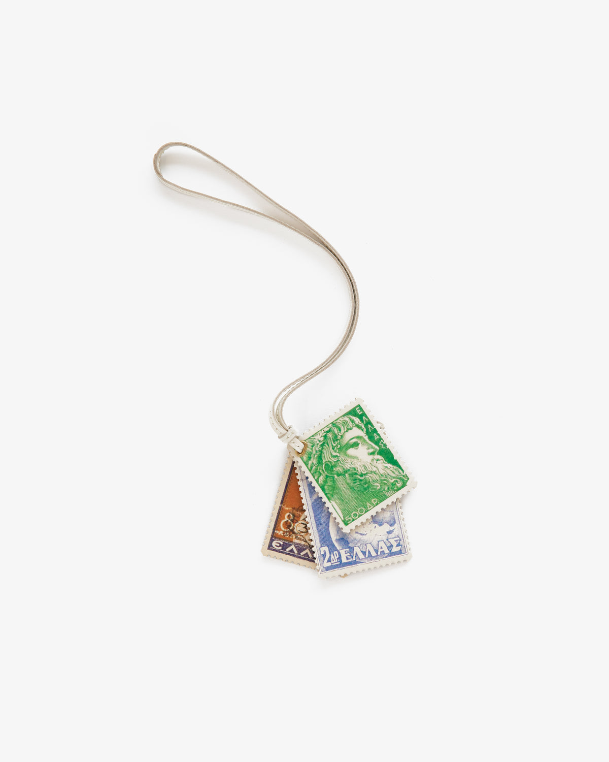 The Leather Traveler Charm features three Greek postage stamp charms in green, brown, and blue on a silver loop.