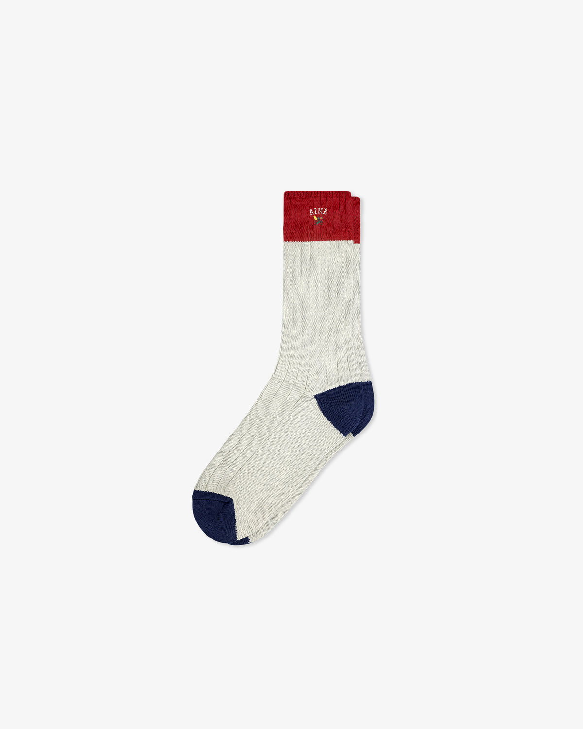 The Crest Varsity Sock is light gray with a red cuff and blue toe and heel, shown on a plain white background.
