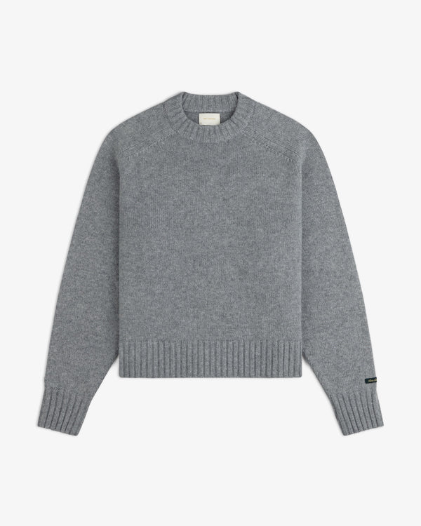 Grey Cashmere Crewneck Sweater with long sleeves and ribbed cuffs and hem.