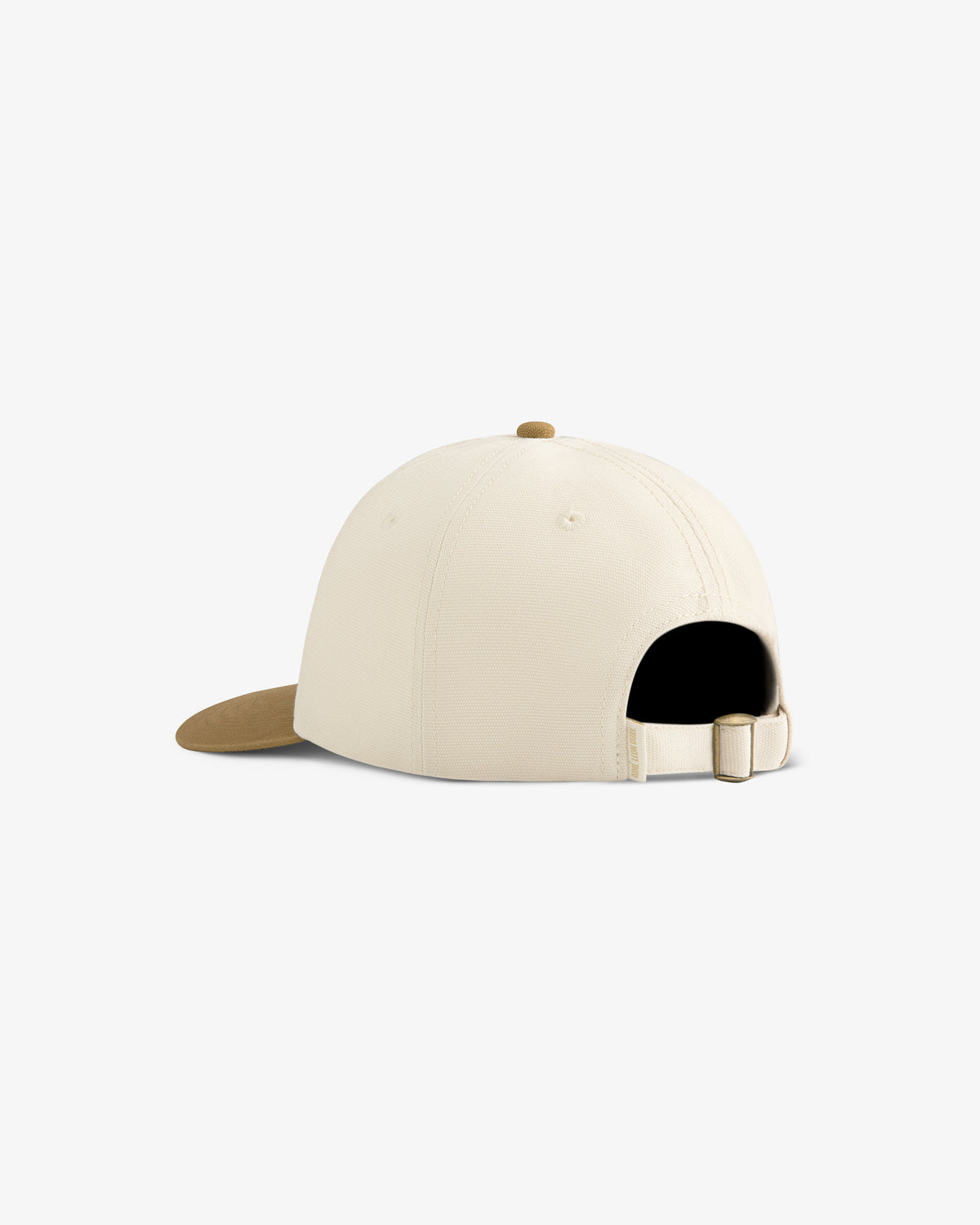 Café Leon Dore / La Marzocco Hat in cream with tan brim, shown from the back with adjustable strap and buckle.