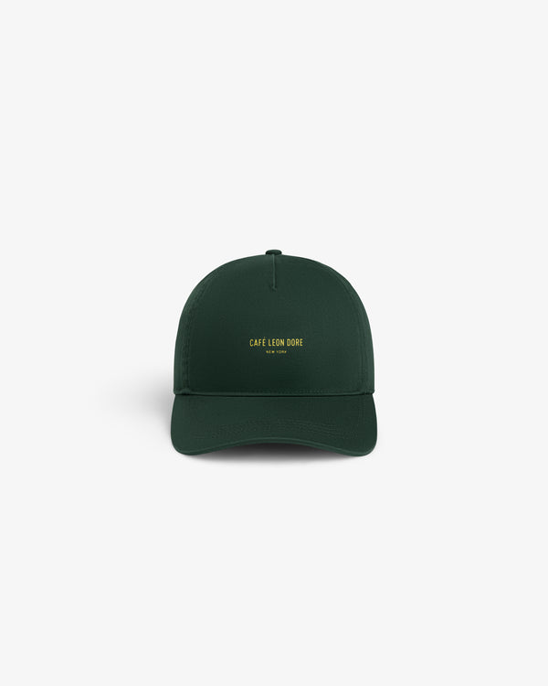 Café Leon Dore Logo Hat in dark green with yellow “CAFÉ LEON DORE NEW YORK” embroidery on the front.
