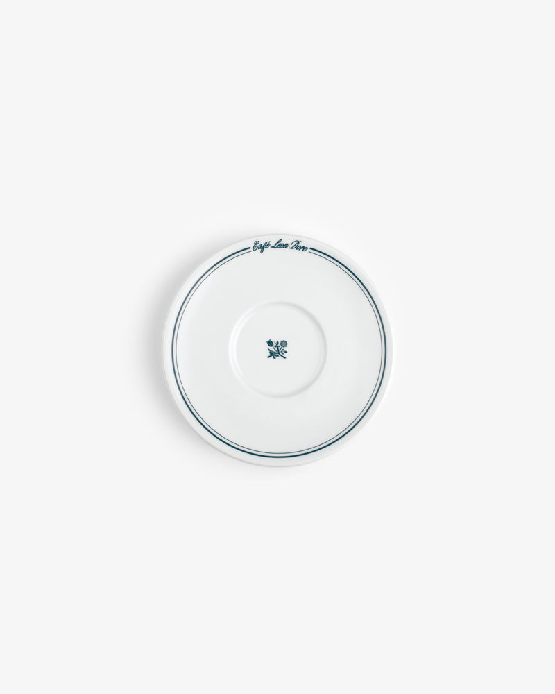 Café Leon Dore saucer: white ceramic with a blue rim, blue flower, and script. Set of 6 cappuccino cups & saucers.