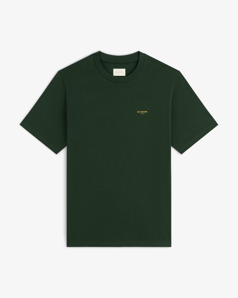 Café Leon Dore Logo Tee in dark green with small yellow chest text, shown on a plain white background.