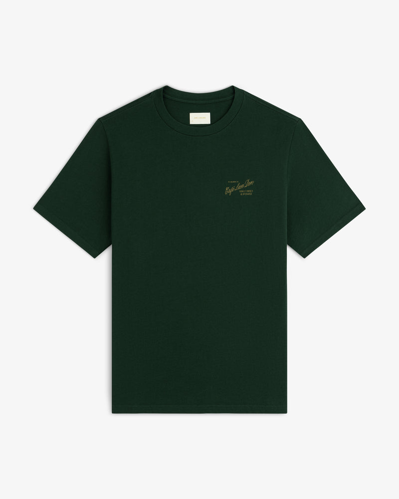 Café Leon Dore Mulberry Tee: dark green, short sleeves, small gold text on left chest, shown on white background.