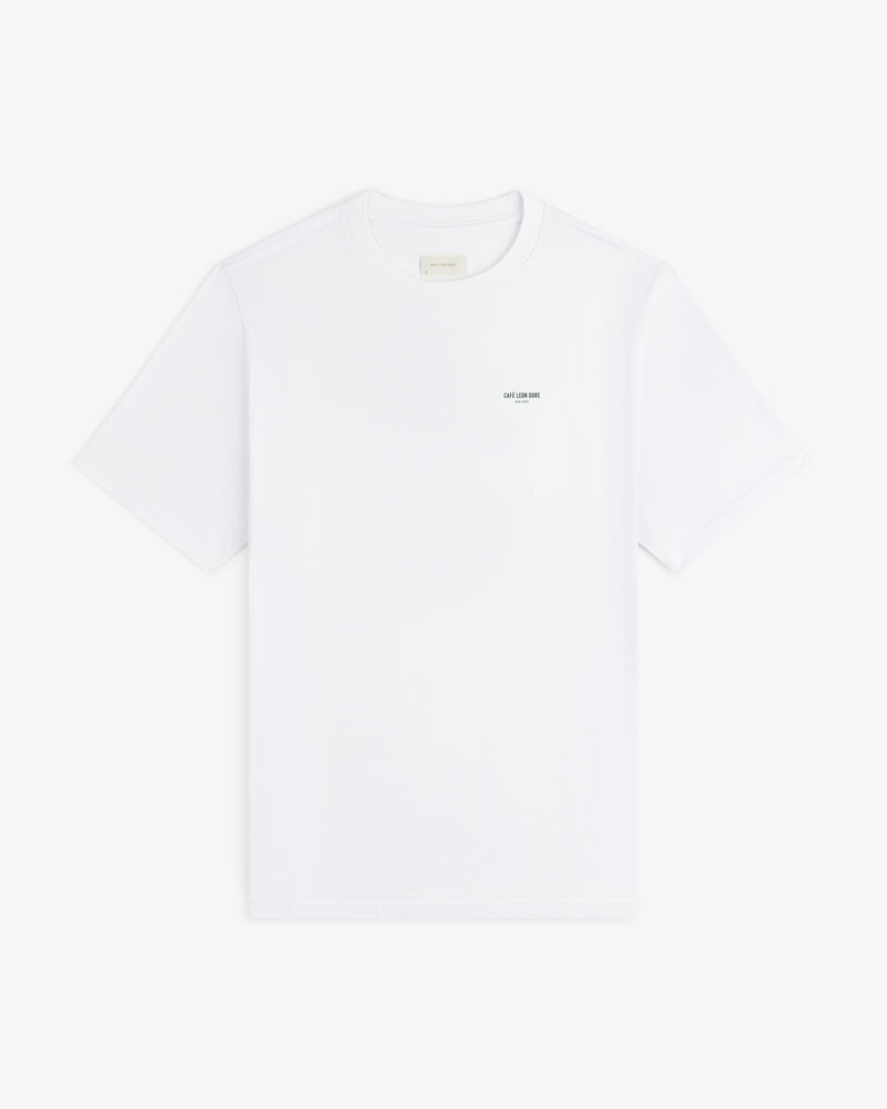 Café Leon Dore Caricature Tee: white short-sleeve shirt with small text on the left chest.