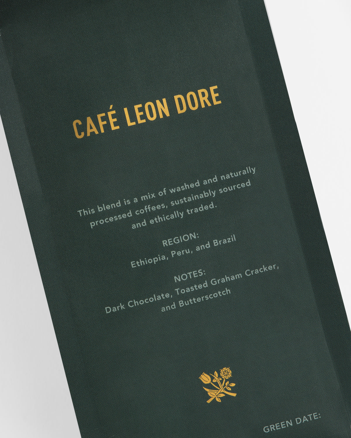 A dark green coffee bag labeled ALD Espresso Beans with blend details and tasting notes in gold text.