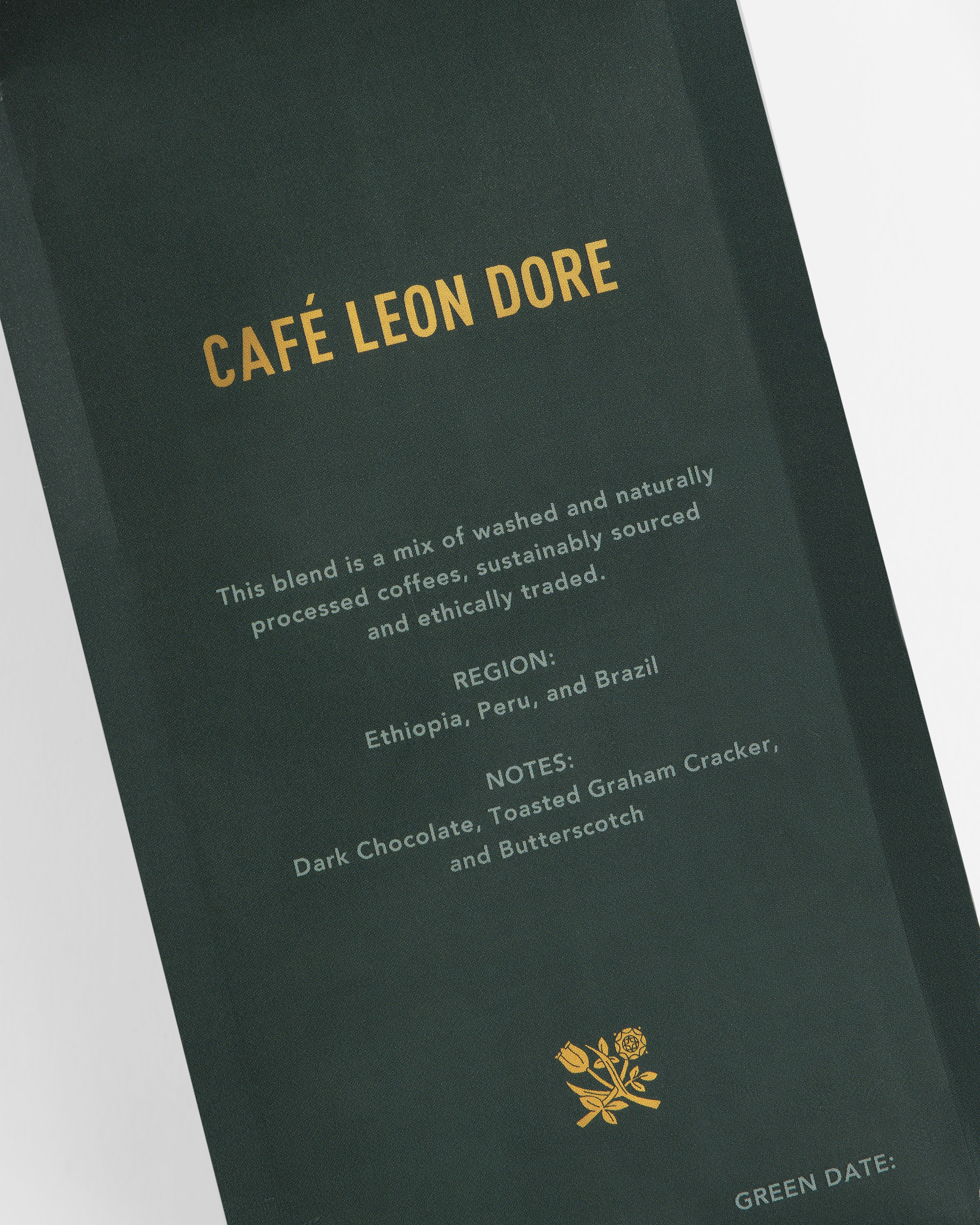 A dark green coffee bag labeled ALD Espresso Beans with blend details and tasting notes in gold text.