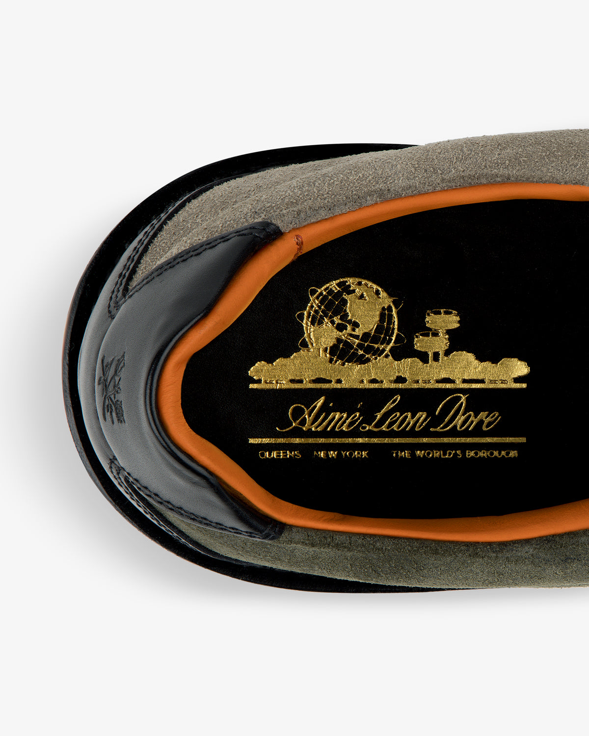 Top view of Suede Derby Hiker with gold Aimé Leon Dore logo on black insole, orange trim, and suede exterior.