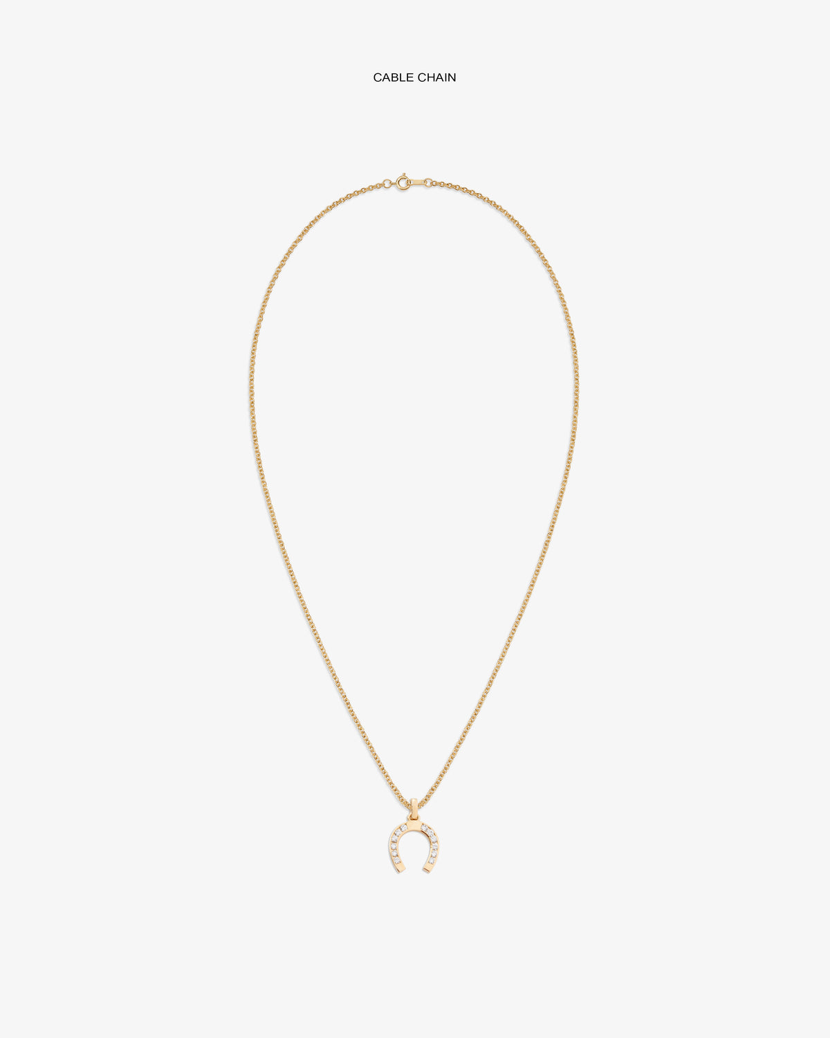Diamond Horseshoe Pendant on gold chain, featuring small clear stones, shown against a white backdrop.