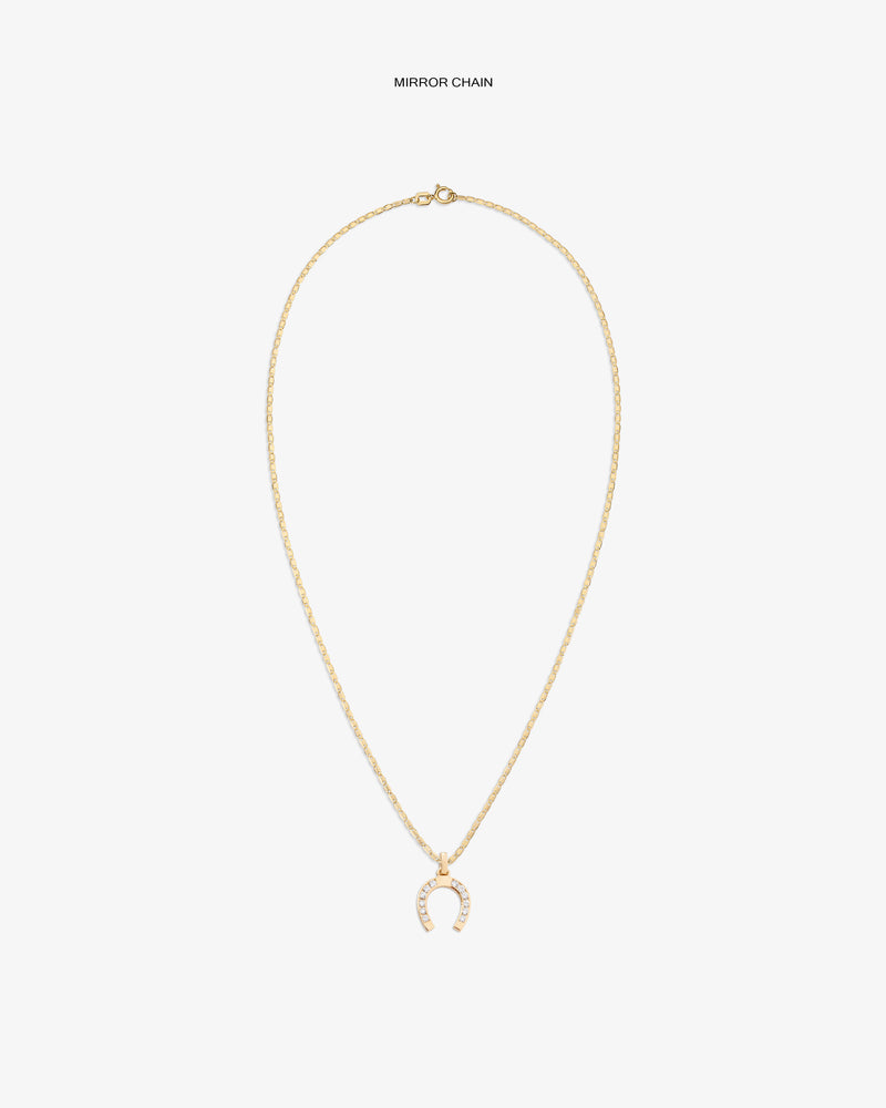 Diamond Horseshoe Pendant: gold chain with a horseshoe-shaped charm set with clear stones, shown on white background.
