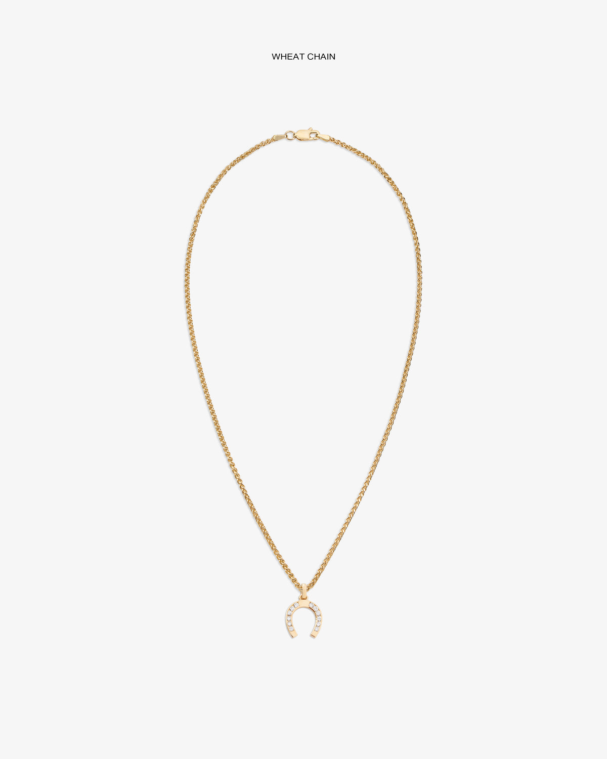 Diamond Horseshoe Pendant on a gold wheat chain, shown against a plain white background.