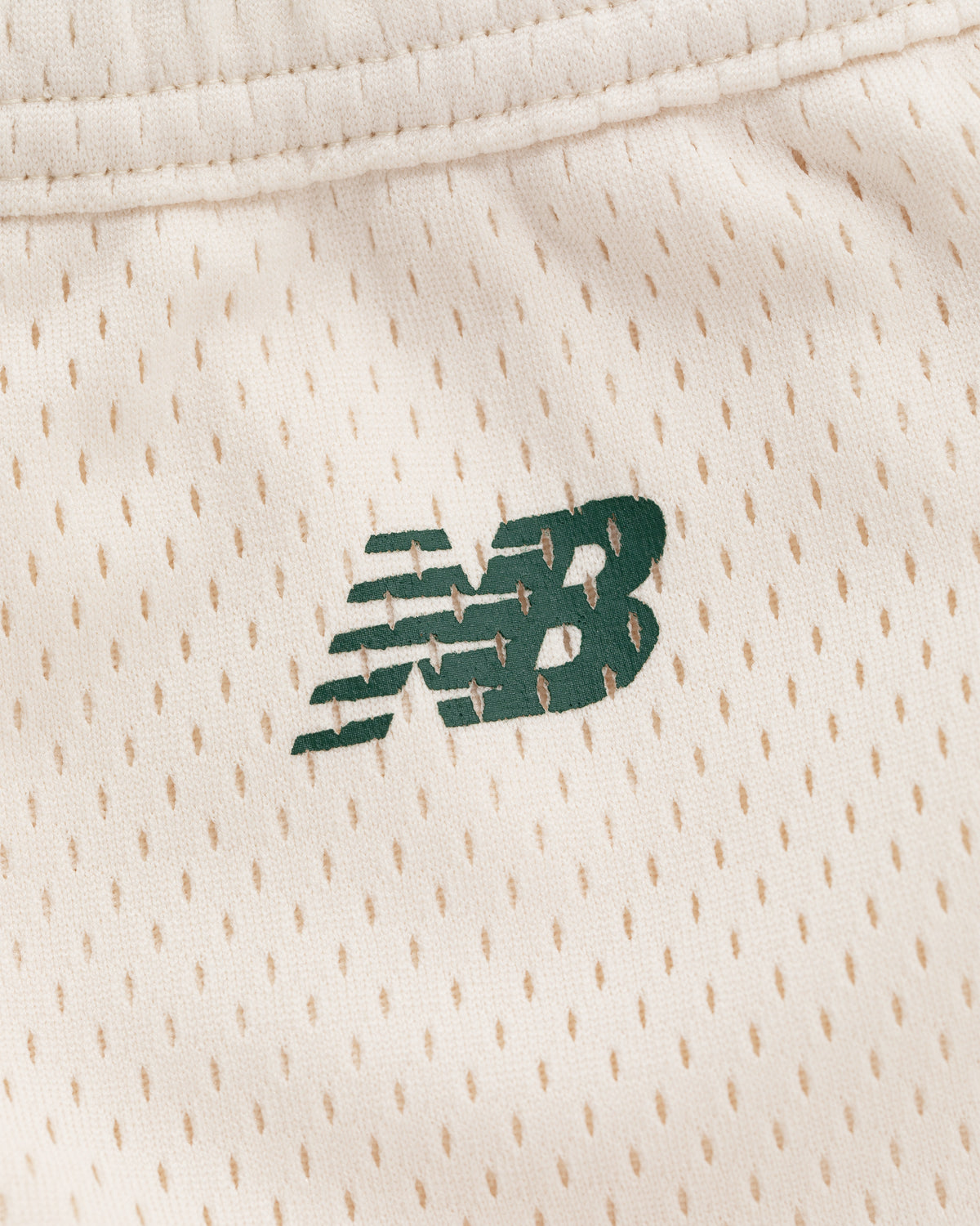 Green New Balance logo on cream perforated athletic fabric of ALD / New Balance SONNY NY Gym Short.