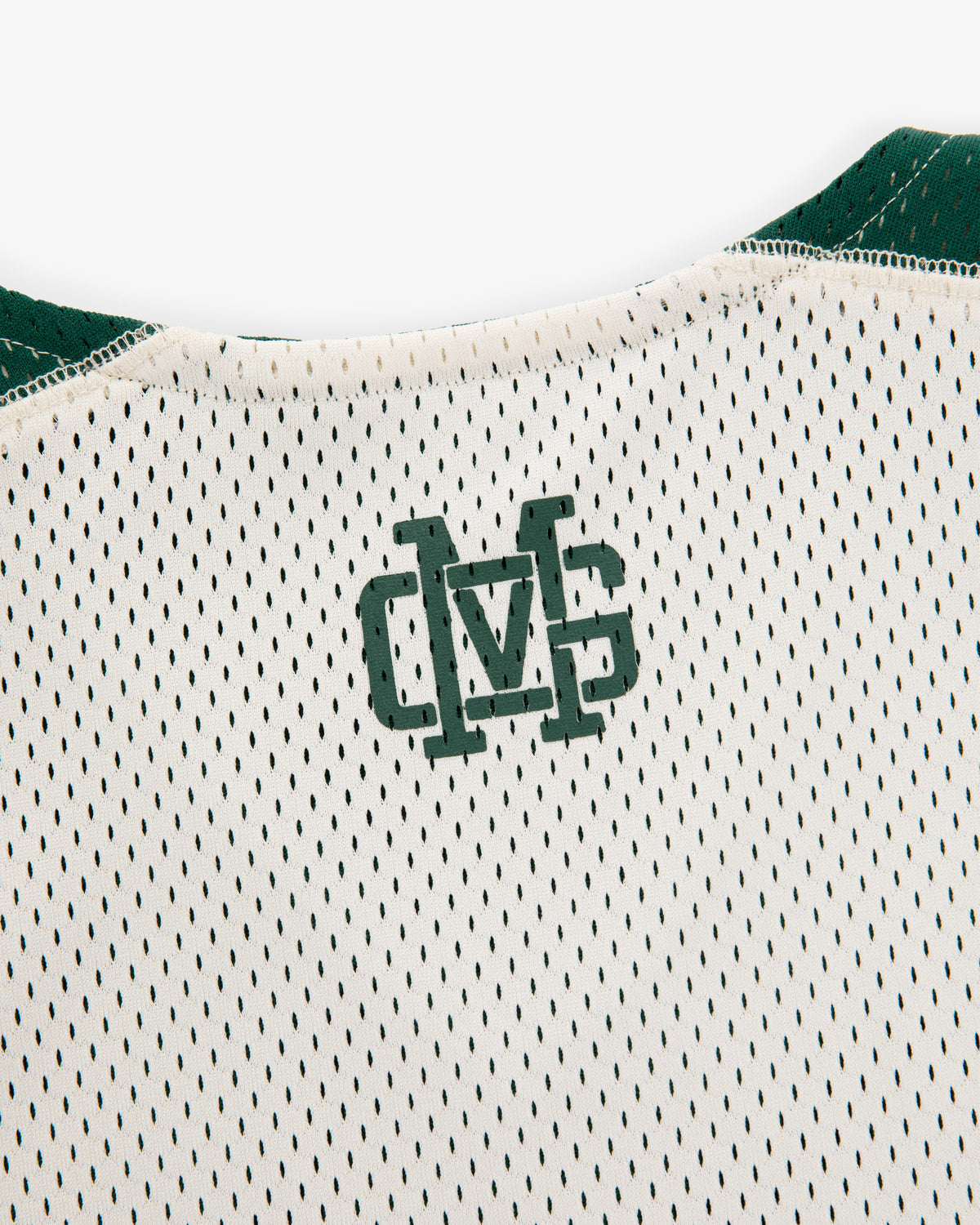 Close-up of the ALD / New Balance SONNY NY Reversible Jersey's back neck with green overlapping “MS” letters.