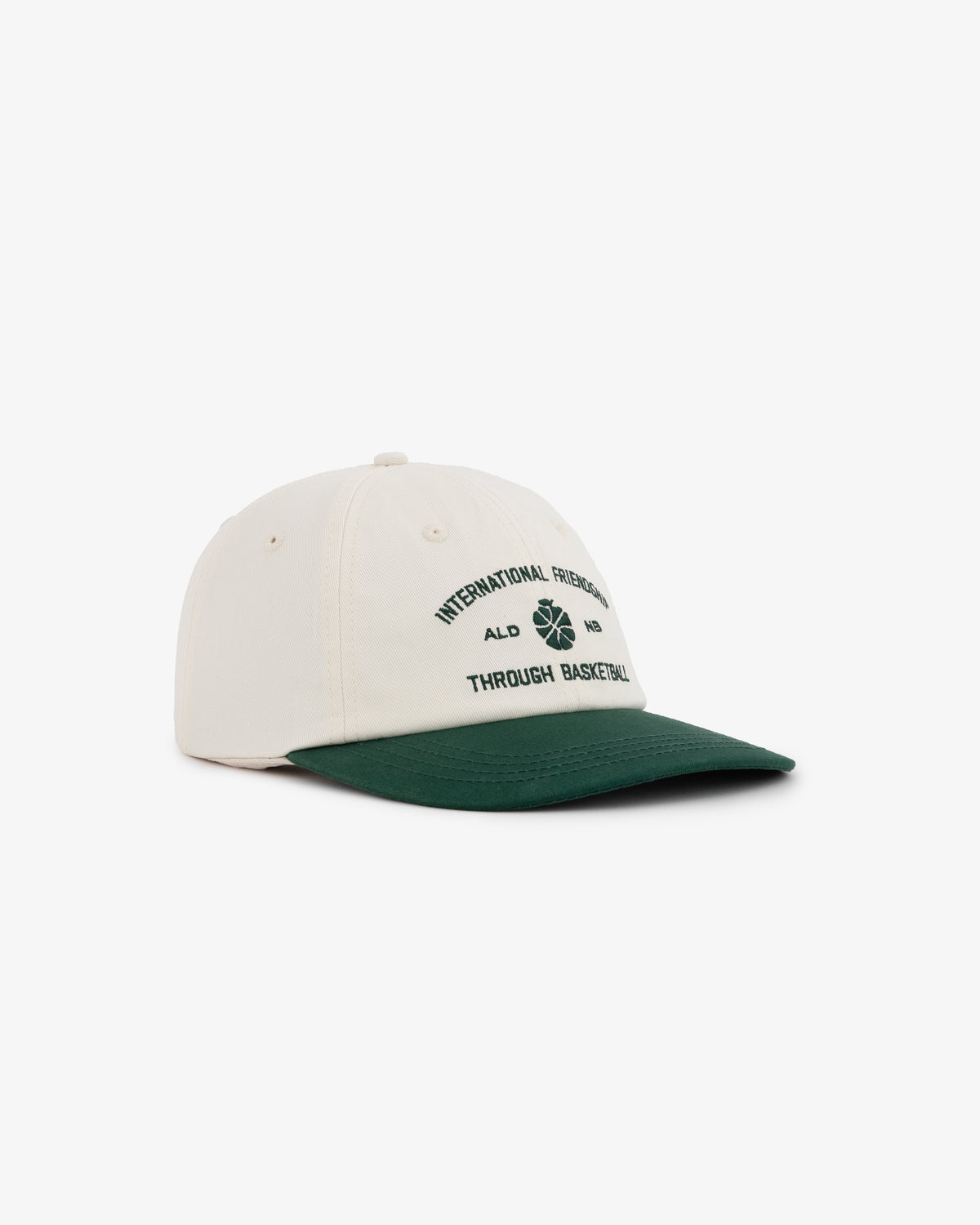 ALD / New Balance SONNY NY IFTB Hat: cream cap with dark green brim, basketball text and graphic on front.