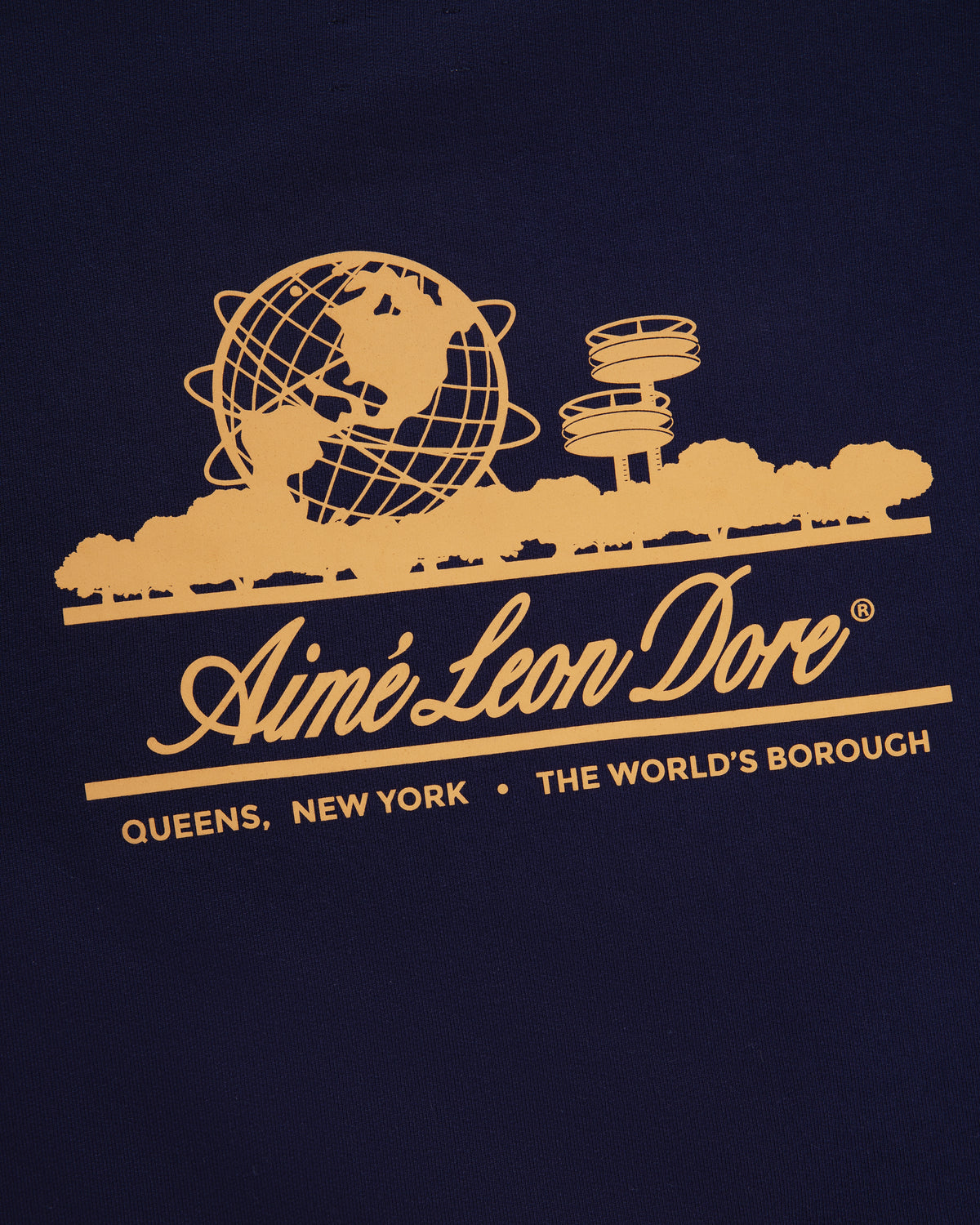 Yellow globe, trees & towers graphic above Aimé Leon Dore and "Queens, New York · The World's Borough" on crewneck.