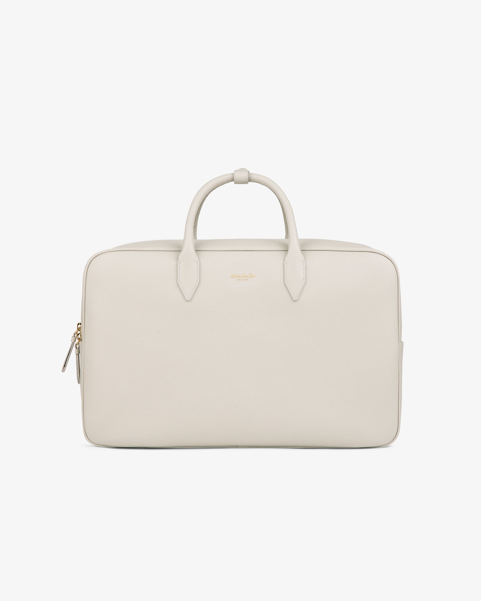 A minimalist, light beige Full Grain Leather Briefcase Duffle with two handles, zipper, and gold-tone hardware.