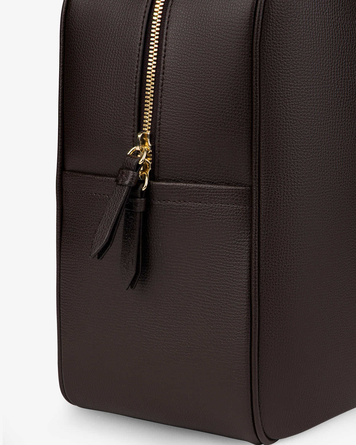 Close-up of the Full Grain Leather Briefcase Duffle with a gold zipper and two leather pulls on a plain light background.