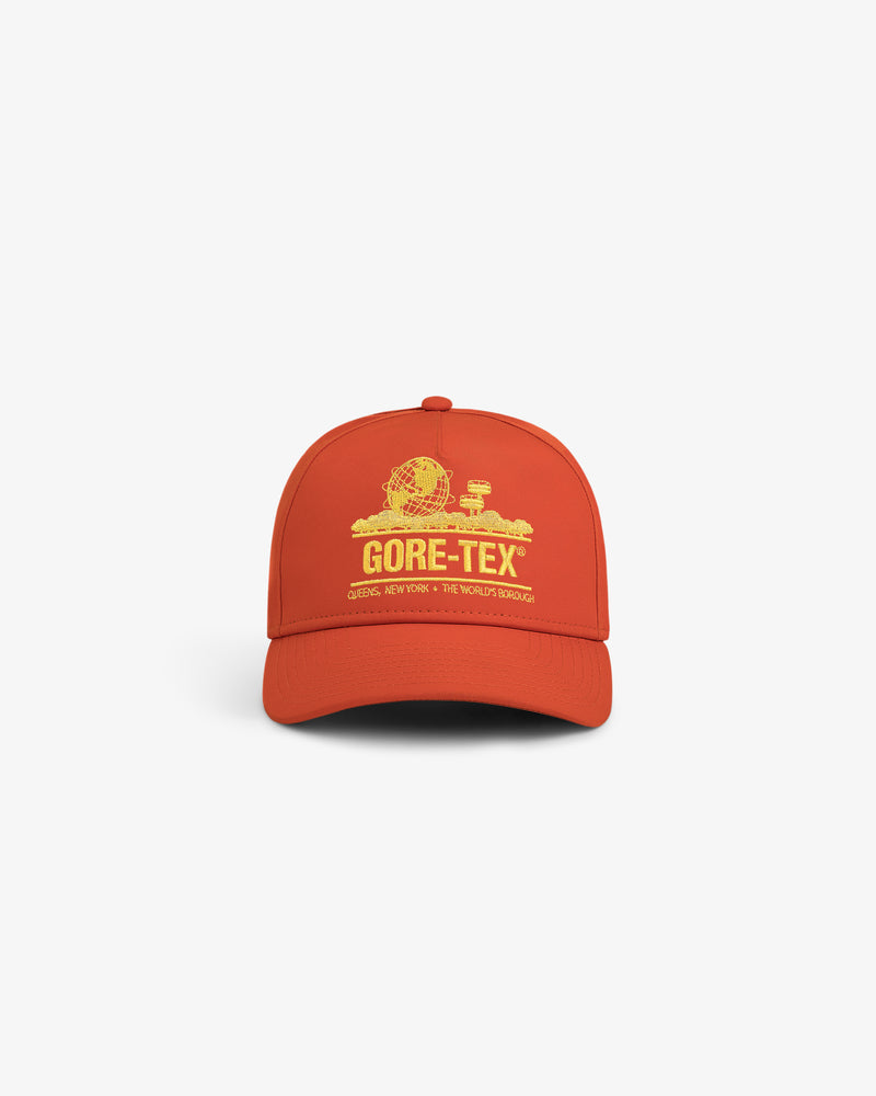 Orange GORE-TEX Unisphere Hat featuring yellow text and graphic on the front, displayed on a white background.