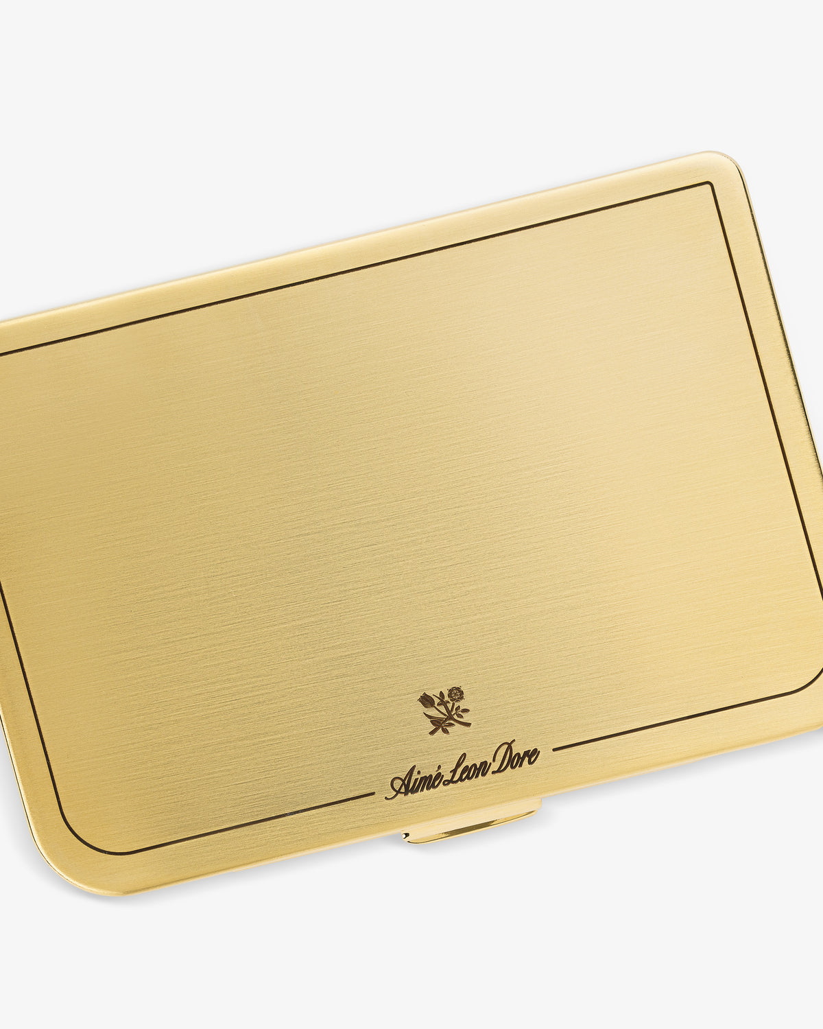 Brass Card Case with a rectangular gold design, thin black border, and Aimé Leon Dore logo at the bottom center.