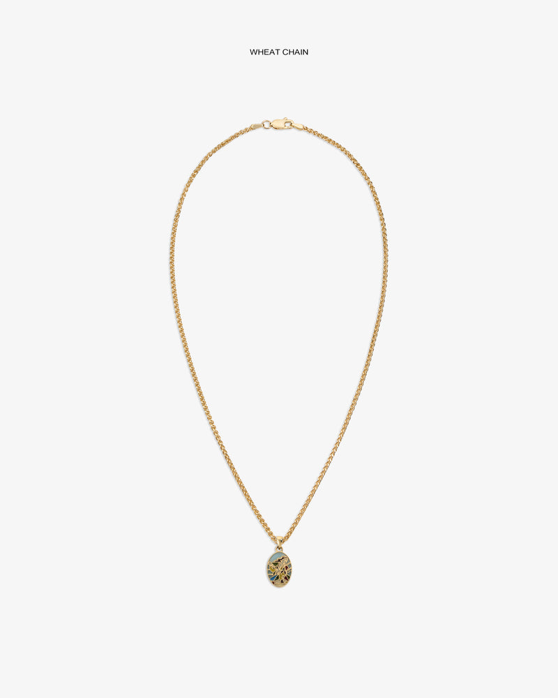 14Kt Gold Molina Pendant on a wheat chain with an intricate oval design, shown against a white background.