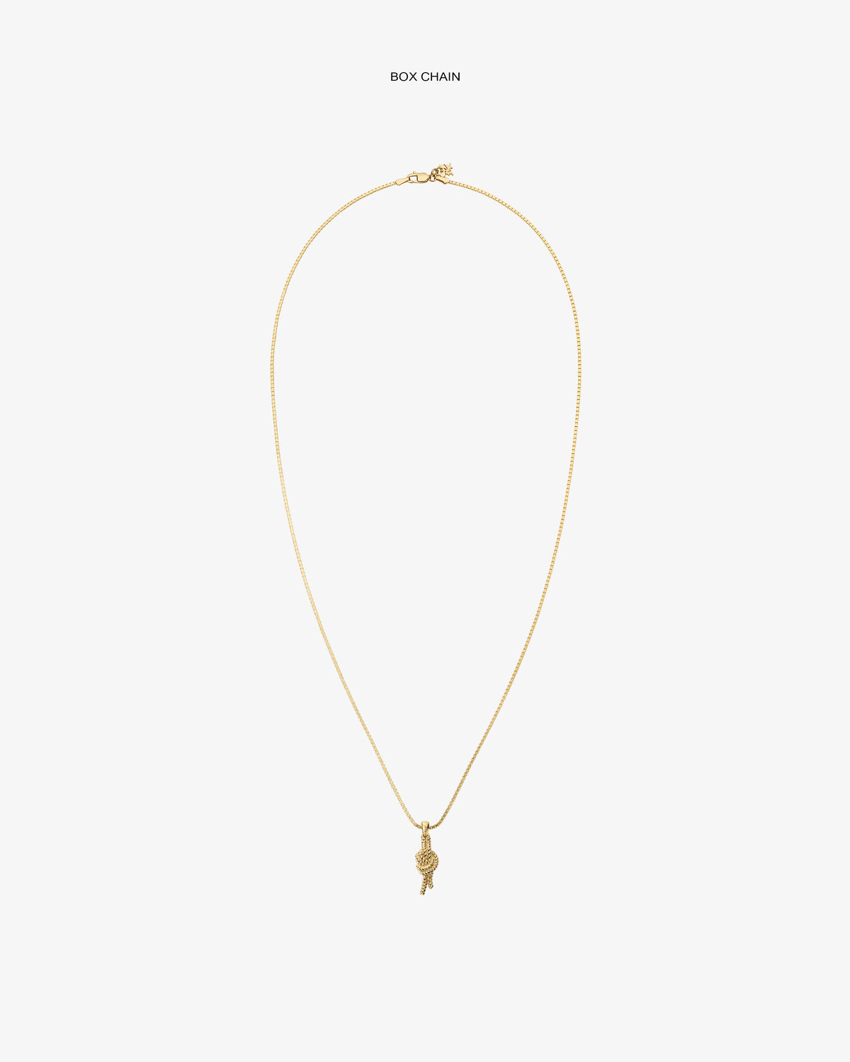 A 14Kt gold box chain necklace with a nautical knot pendant, displayed on a plain white background.