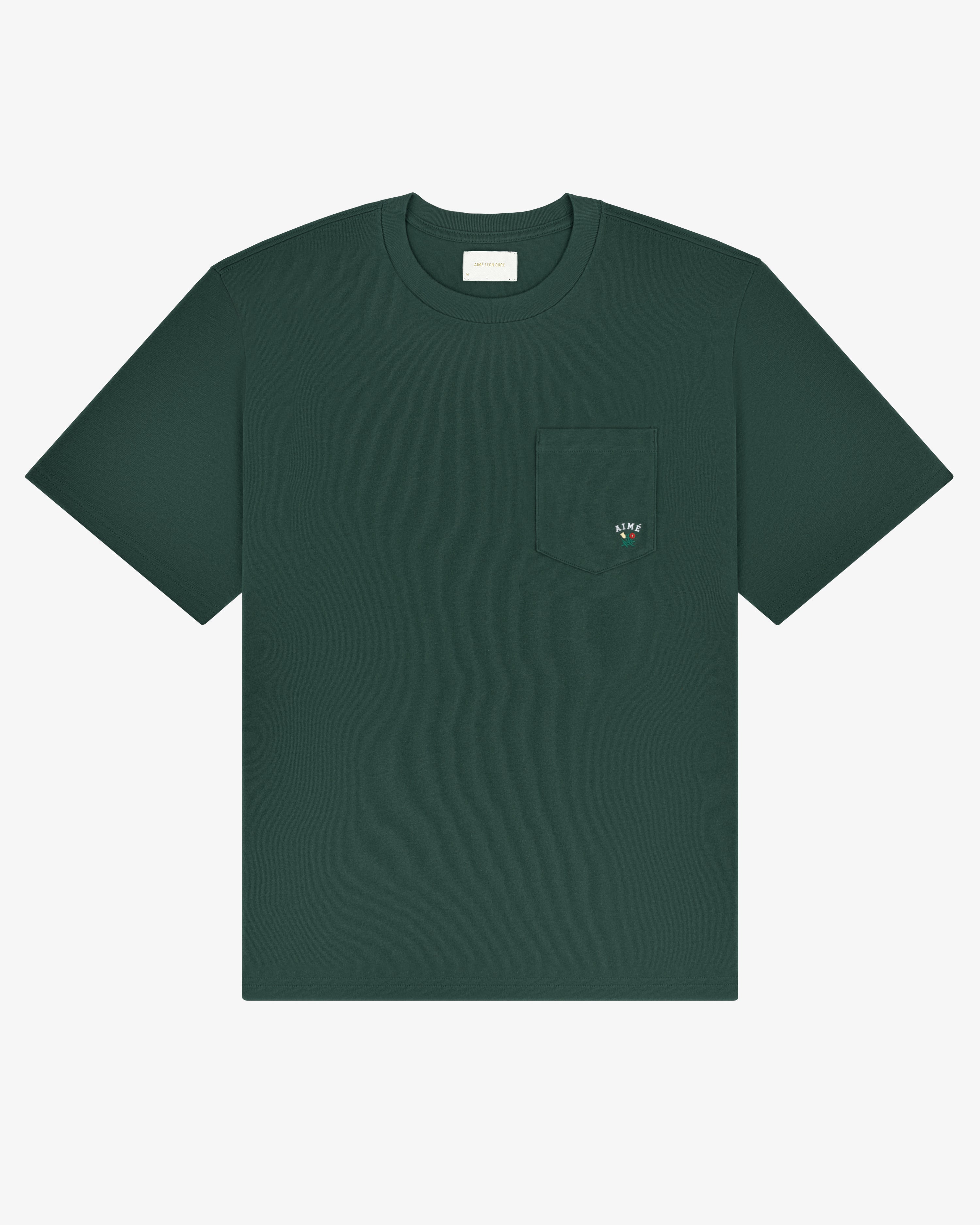 Crest Pocket Tee: dark green, short sleeves, chest pocket with small embroidered design.