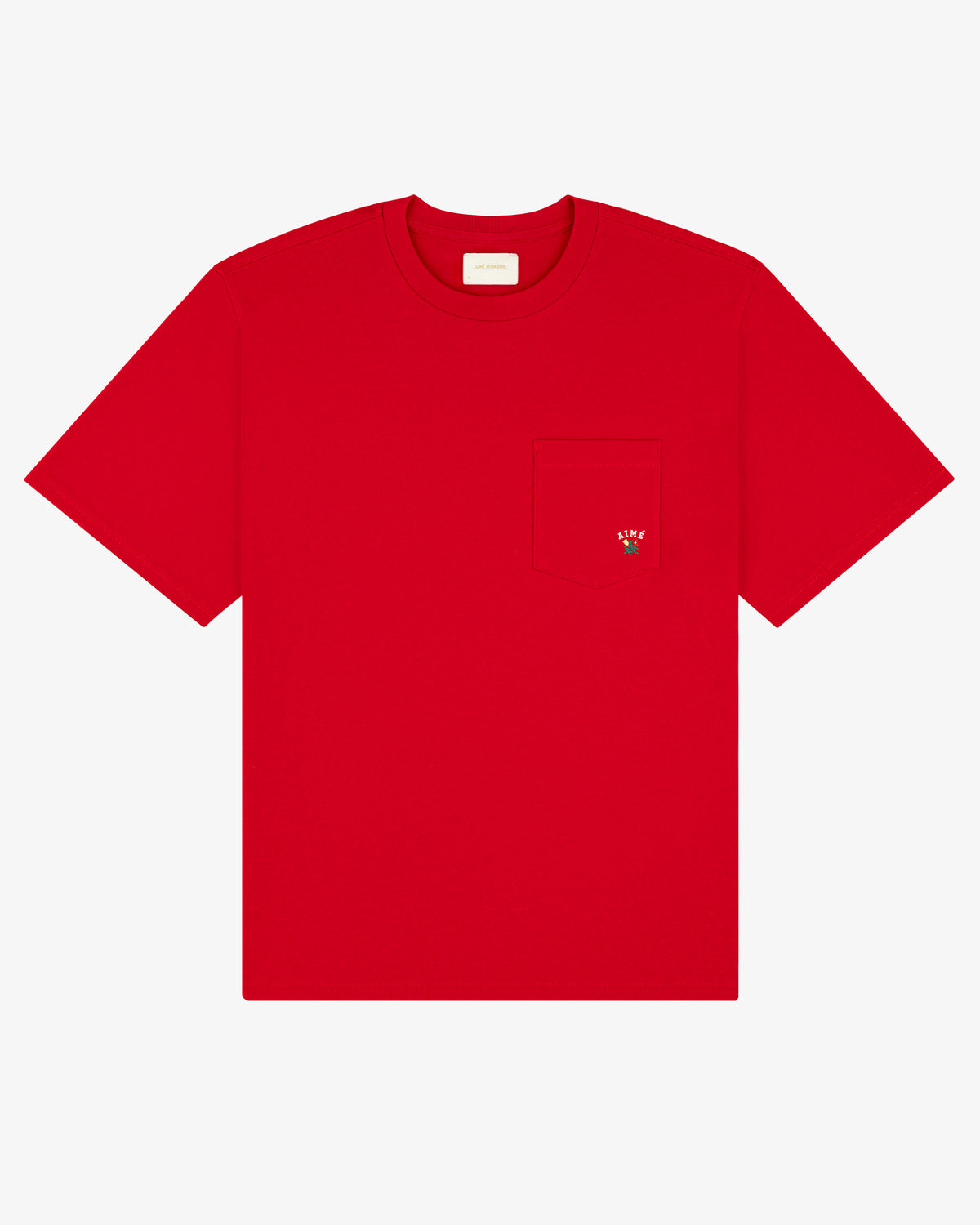The Crest Pocket Tee is a plain red T-shirt with a chest pocket and a small embroidered strawberry on it.