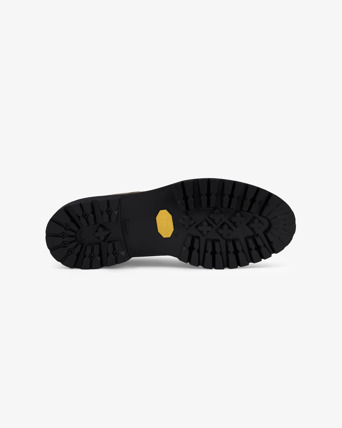 The Suede Lug Sole Derby features a black lugged sole with a yellow hexagonal logo on a white background.