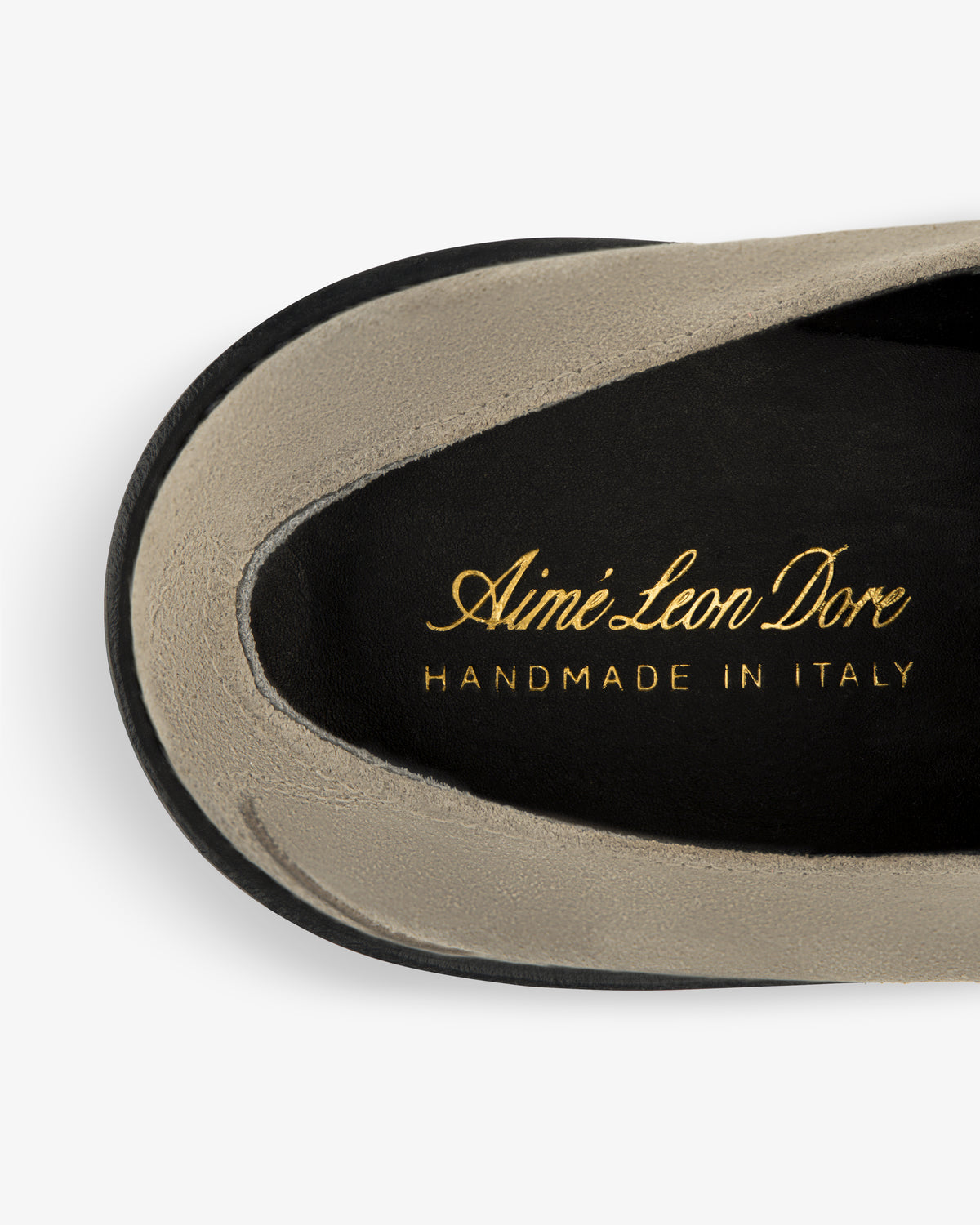Top view of Suede Lug Sole Derby insole with Aimé Leon Dore HANDMADE IN ITALY printed in gold lettering.