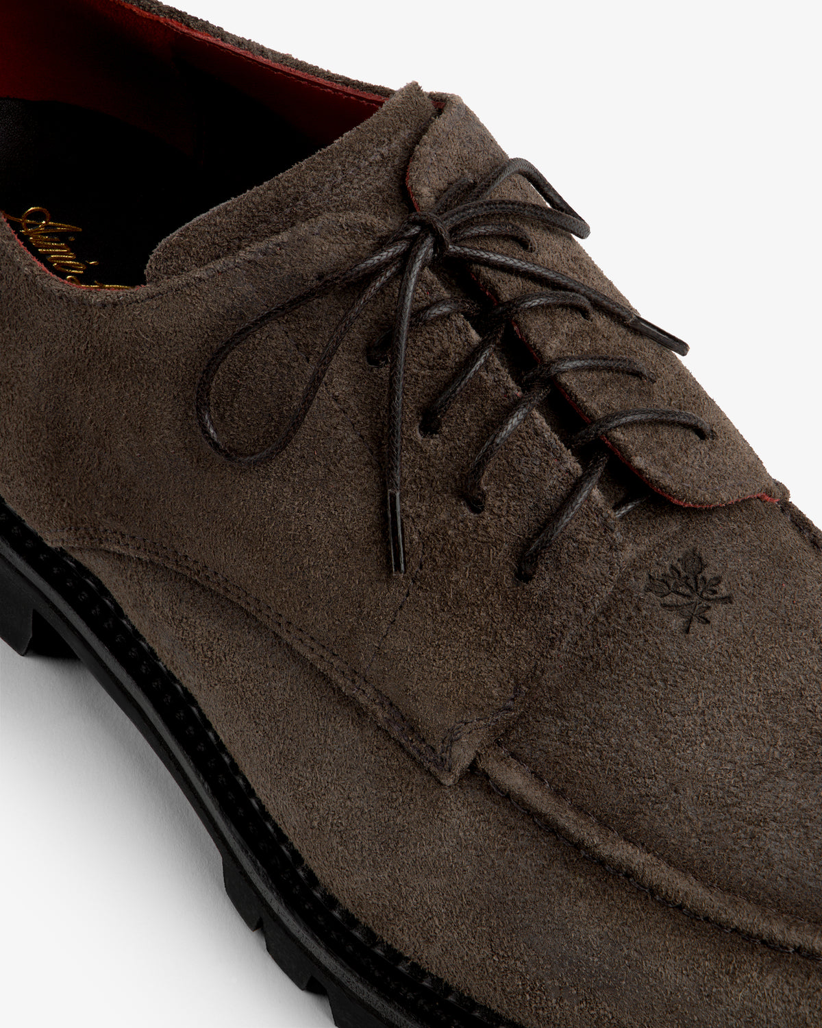 Suede Lug Sole Derby in dark brown suede with a thick black lug sole and dark laces.