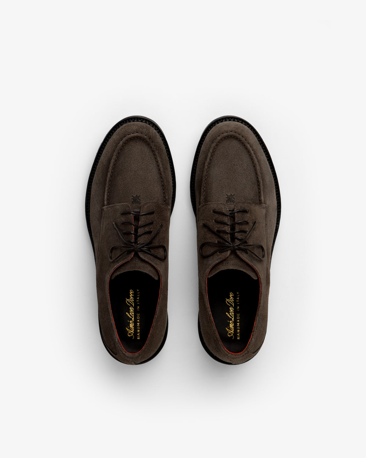 A pair of brown Suede Lug Sole Derby shoes with thick lug soles seen from above.