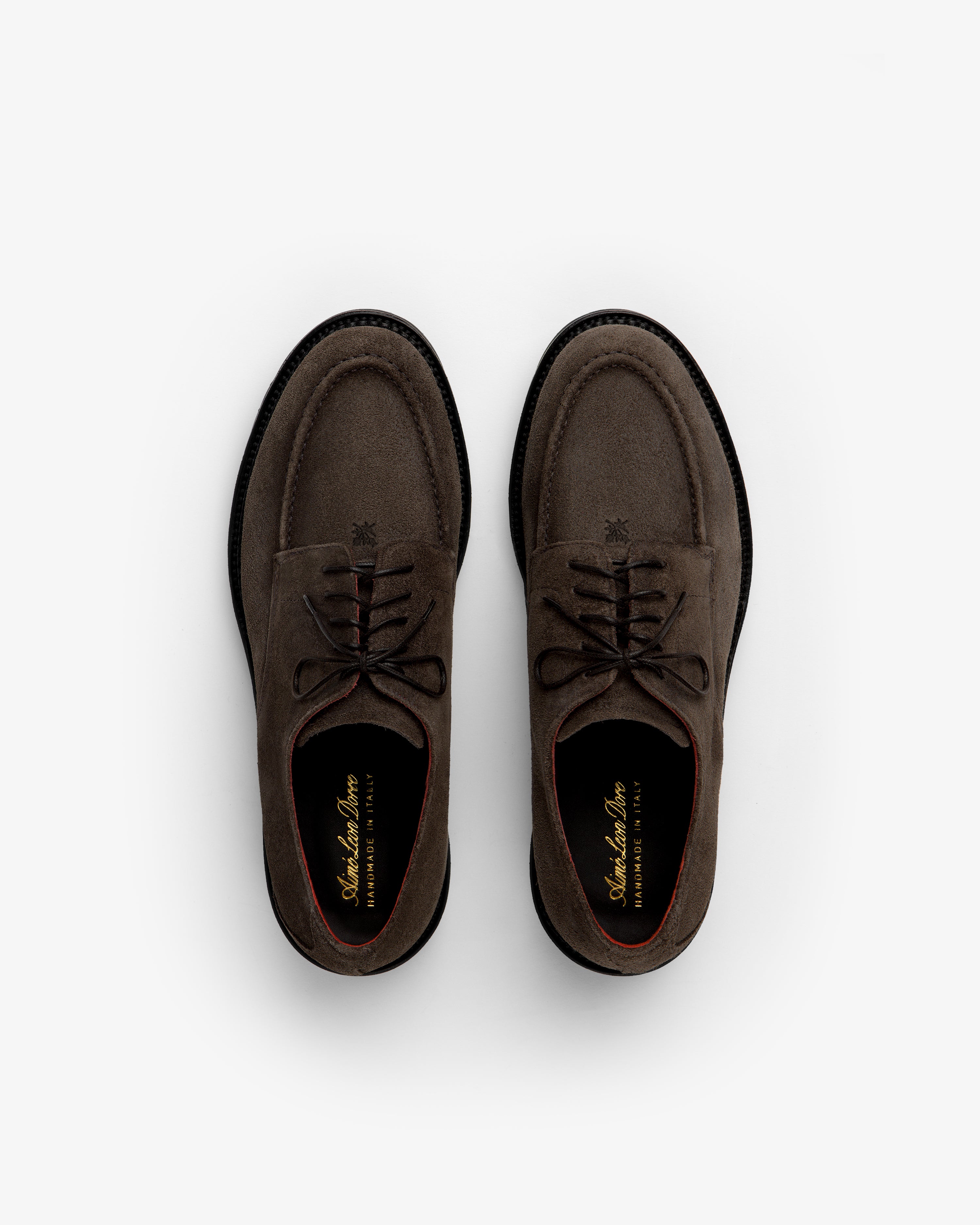 A pair of brown Suede Lug Sole Derby shoes with thick lug soles seen from above.
