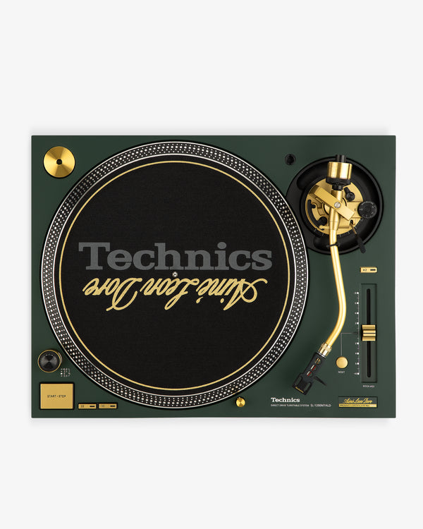 Overhead view of the ALD / Technics SL-1200M7ALD Turntable with gold accents and a "Slime Foe Ever" slipmat.