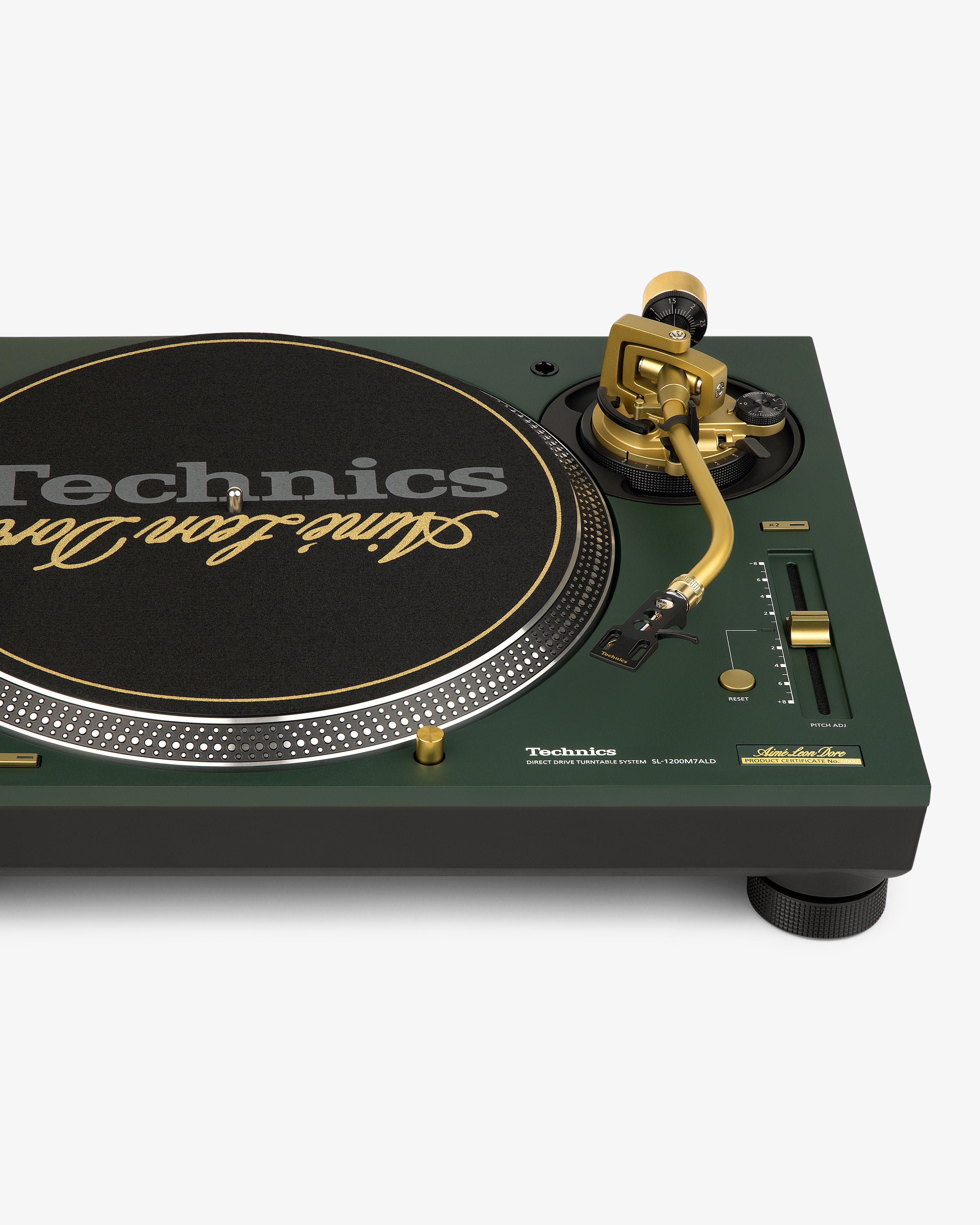 Close-up of an ALD / Technics SL-1200M7ALD Turntable in green and gold with a branded slipmat and control knobs.