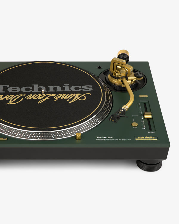 Close-up of an ALD / Technics SL-1200M7ALD Turntable in green and gold with a branded slipmat and control knobs.