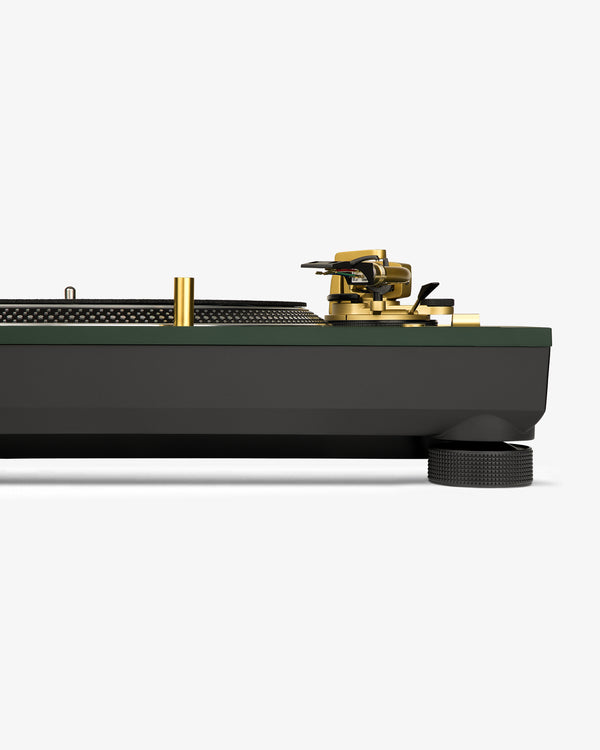 Side view of the ALD / Technics SL-1200M7ALD Turntable with gold accents, green-black base on white background.
