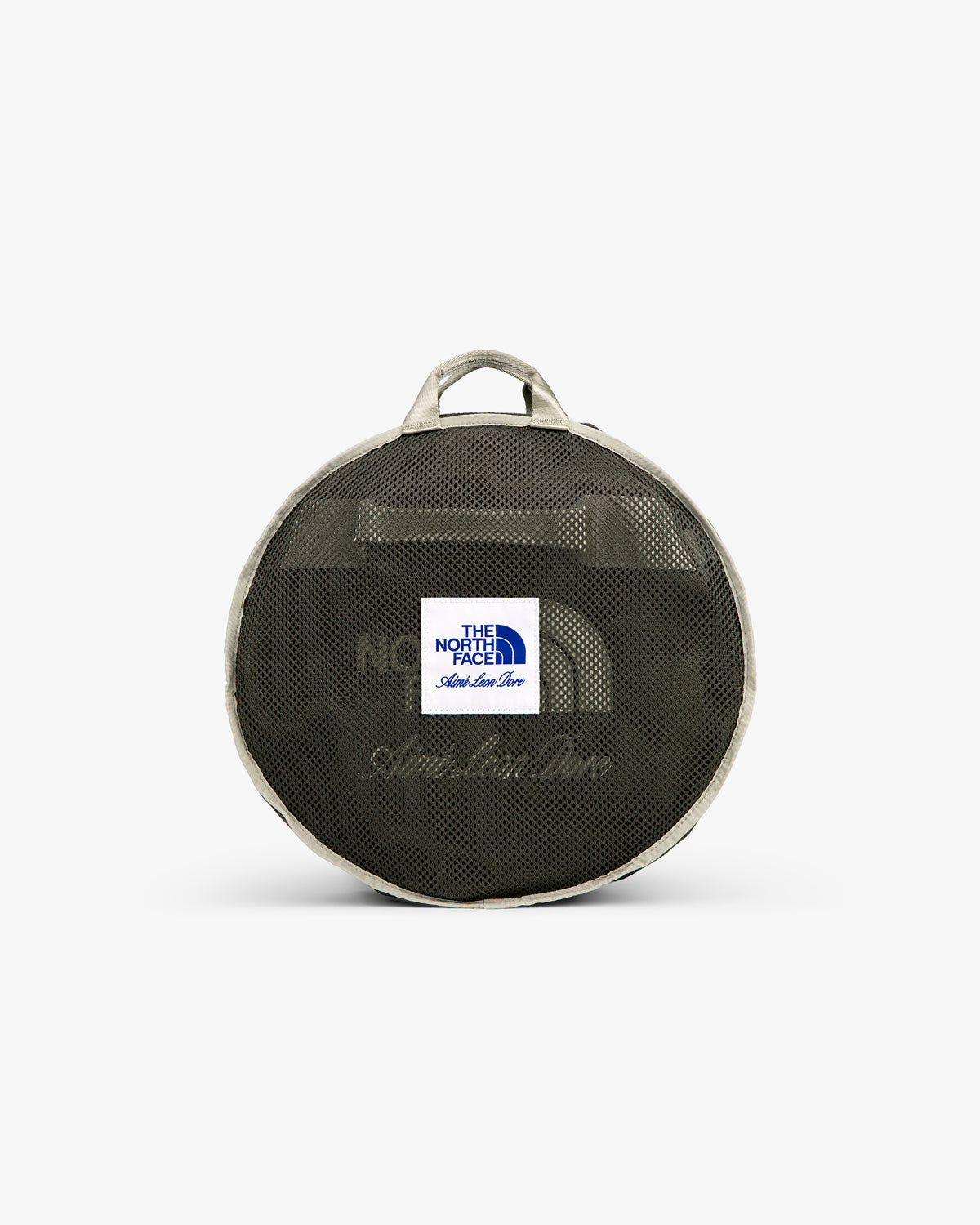 ALD / The North Face Base Camp Duffel: round mesh bag with logo patch, beige trim, and two handles, on white backdrop.