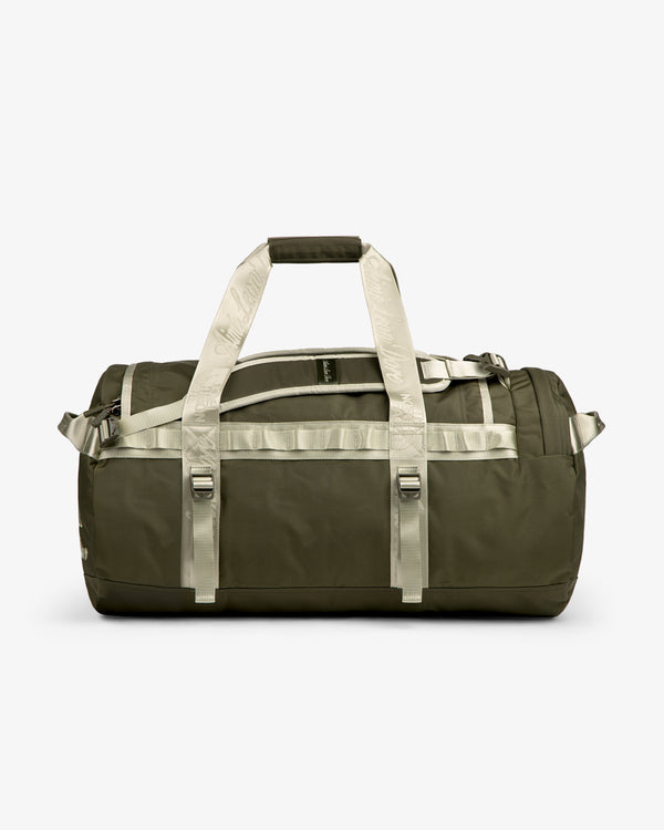 ALD / The North Face Base Camp Duffel in olive green with beige straps, side view on a white background.