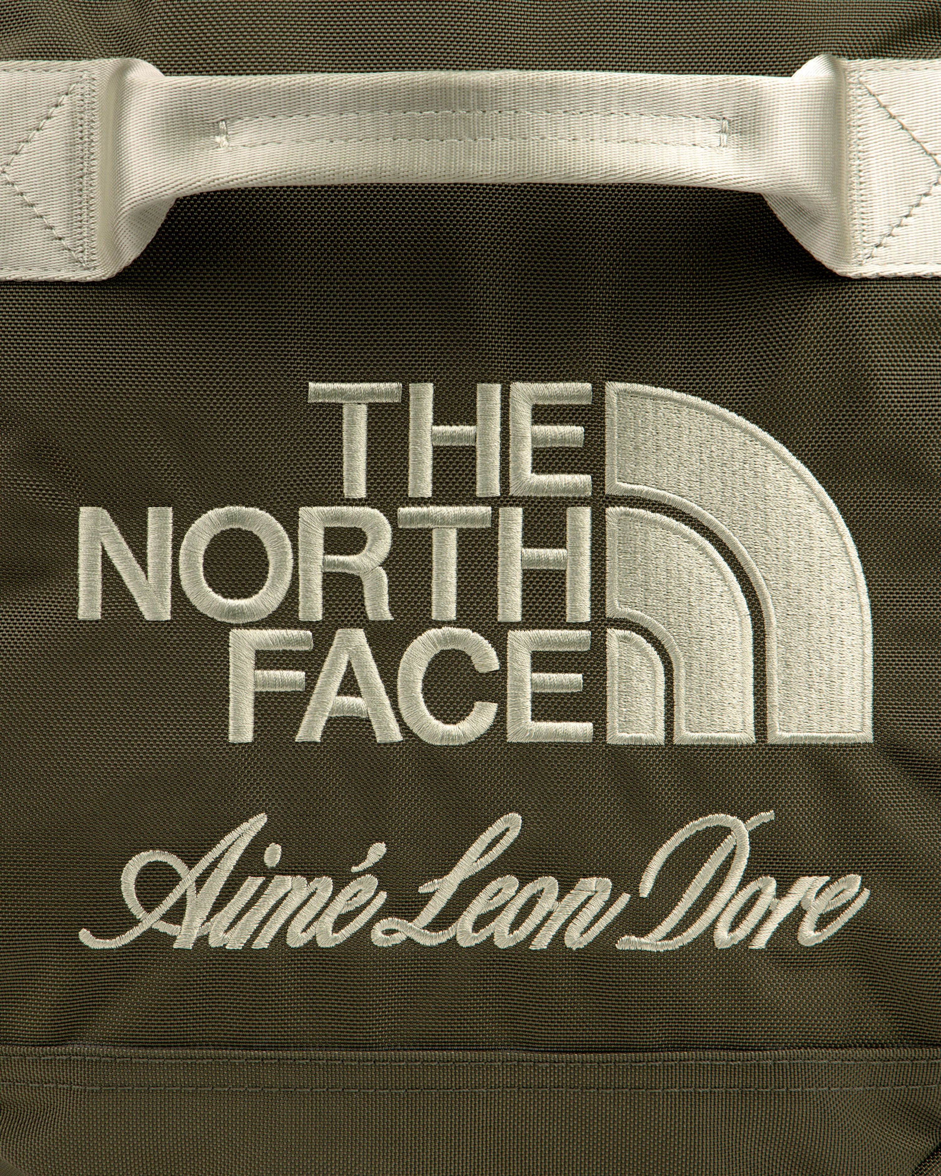 Olive green ALD / The North Face Base Camp Duffel with both brand names embroidered in white.