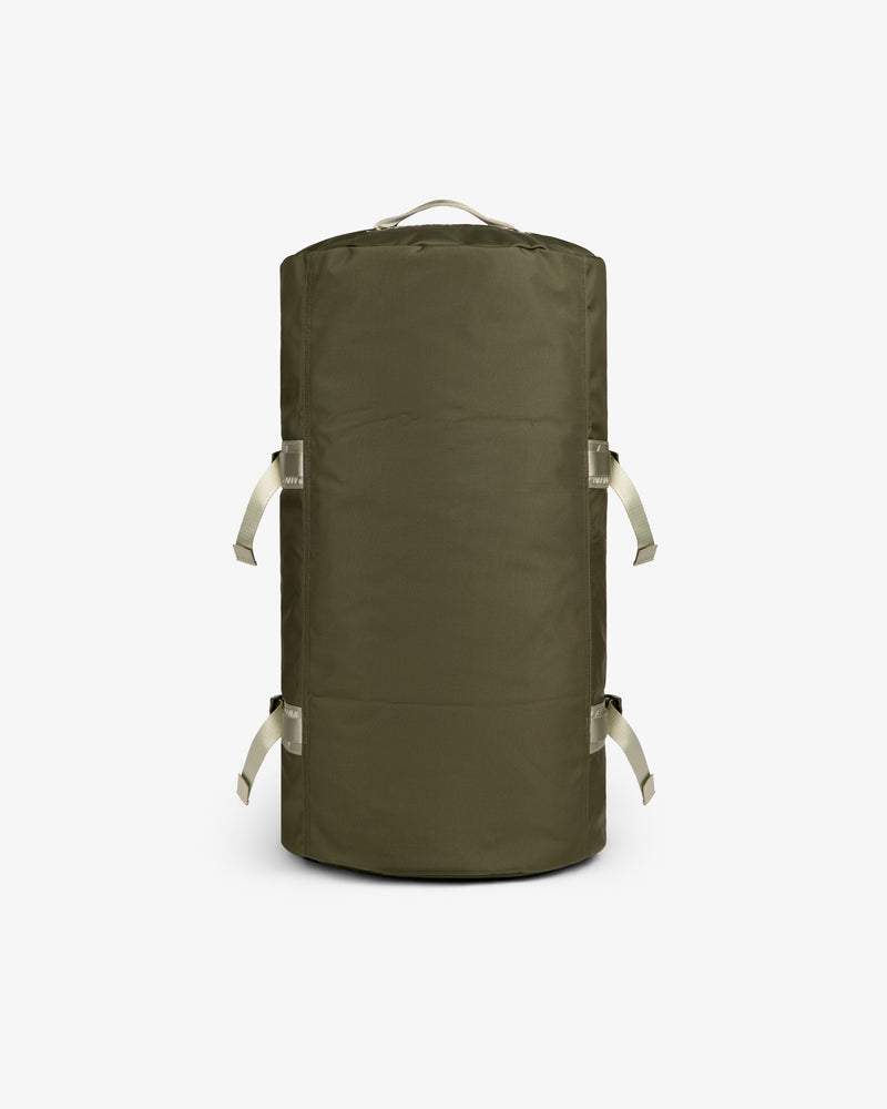 ALD / The North Face Base Camp Duffel in olive green with beige handles, displayed on a white background.